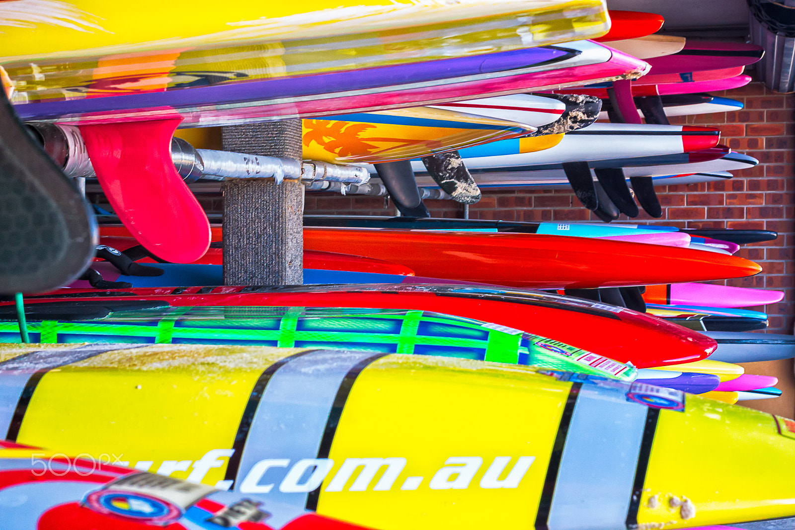 Canon EOS 50D + Canon EF 40mm F2.8 STM sample photo. Surf boards on a rack photography