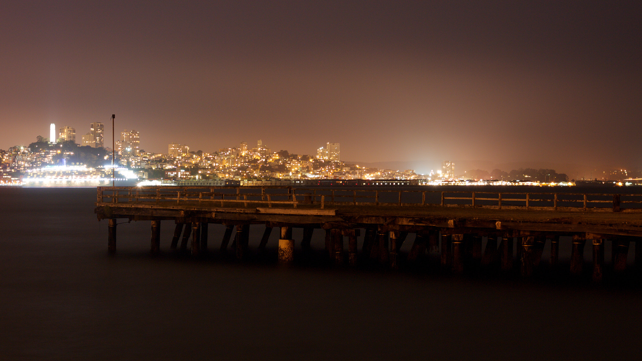 Canon EOS M + Canon EF 50mm F1.8 II sample photo. In one of the largest city in the world, an abandoned pier is found. photography