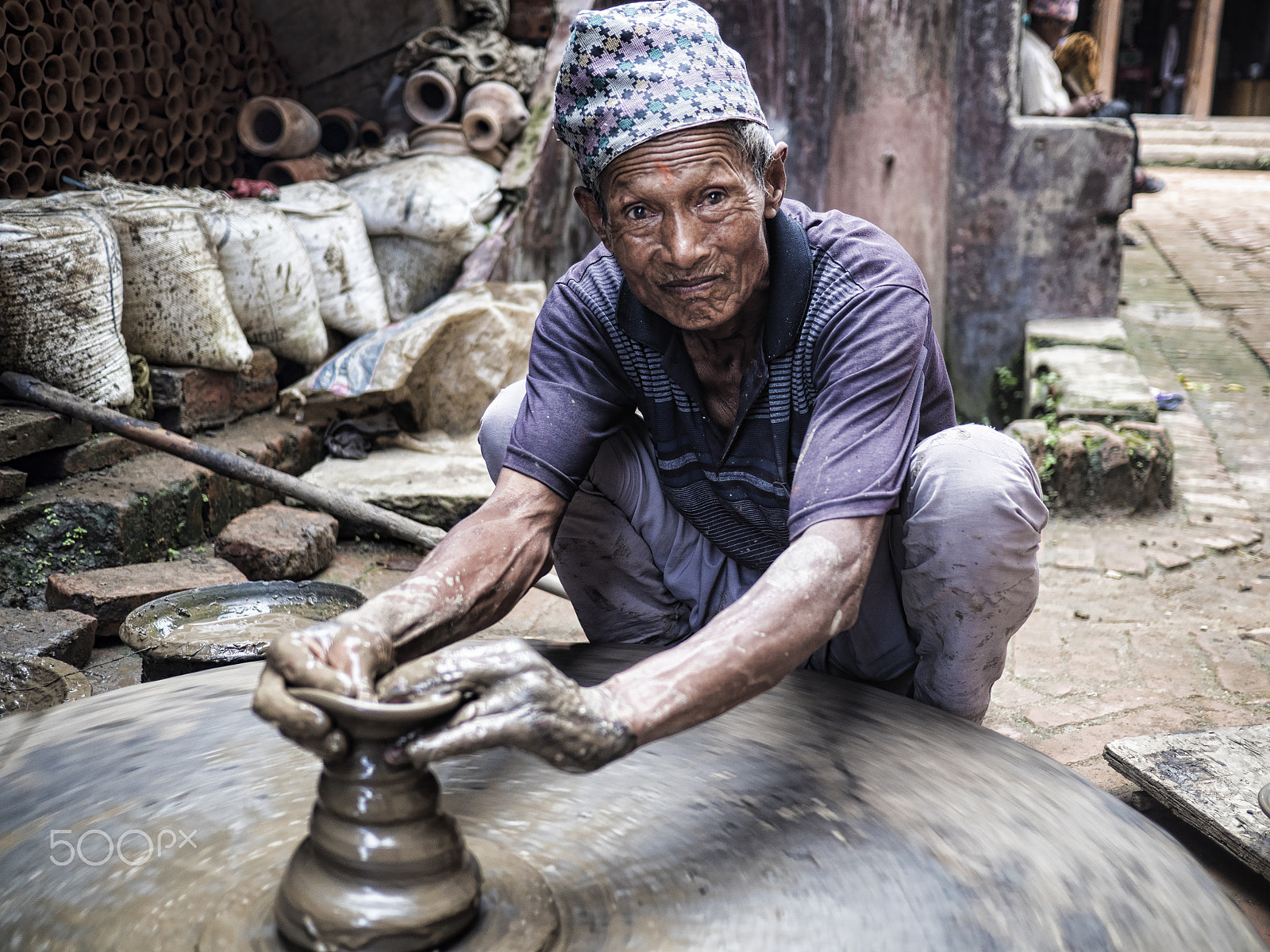 Olympus OM-D E-M5 II + Panasonic Lumix G 20mm F1.7 ASPH sample photo. Potter wheel , pottery square , bhaktapur, nepal photography