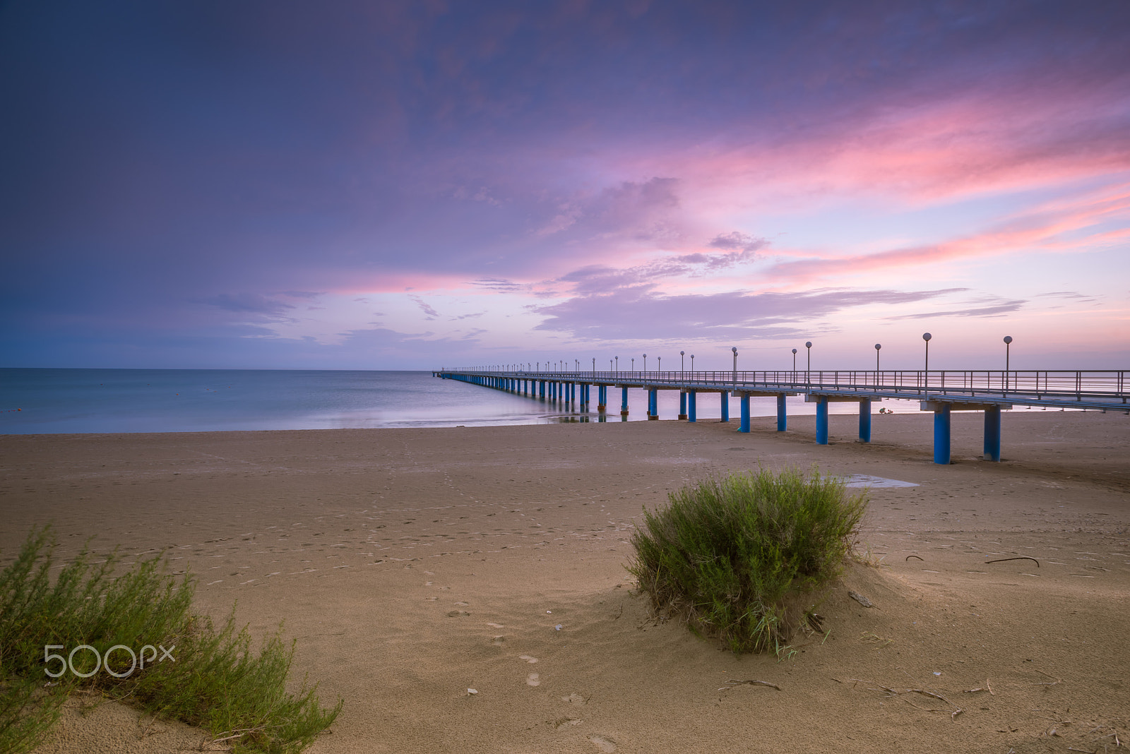 Sony a7R + Canon EF 17-40mm F4L USM sample photo. Sunset on the beach after a storm, the pier and the in the evening photography