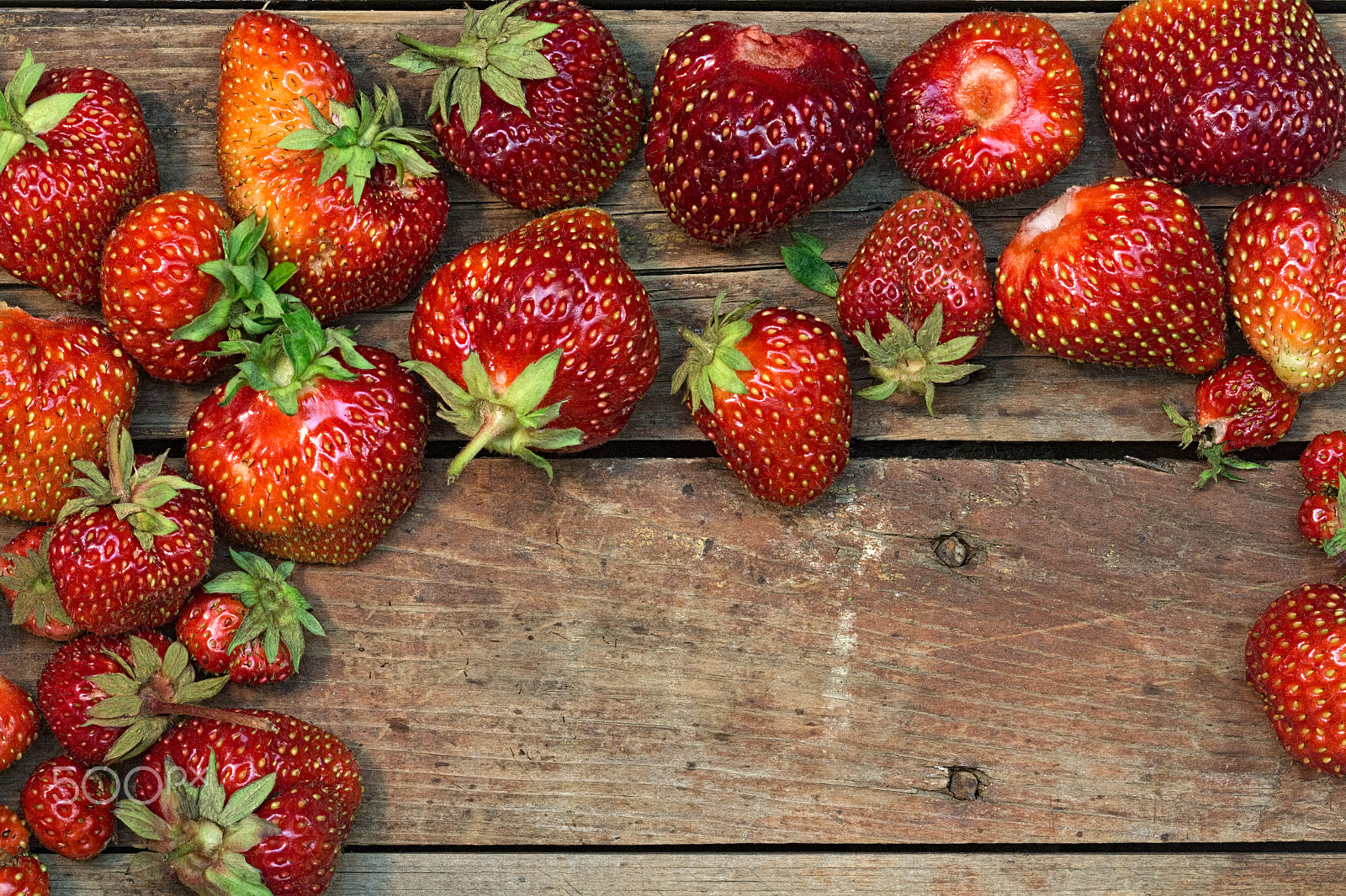 Canon EF 100mm F2.8 Macro USM sample photo. Strawberries on a rough wooden background. photography