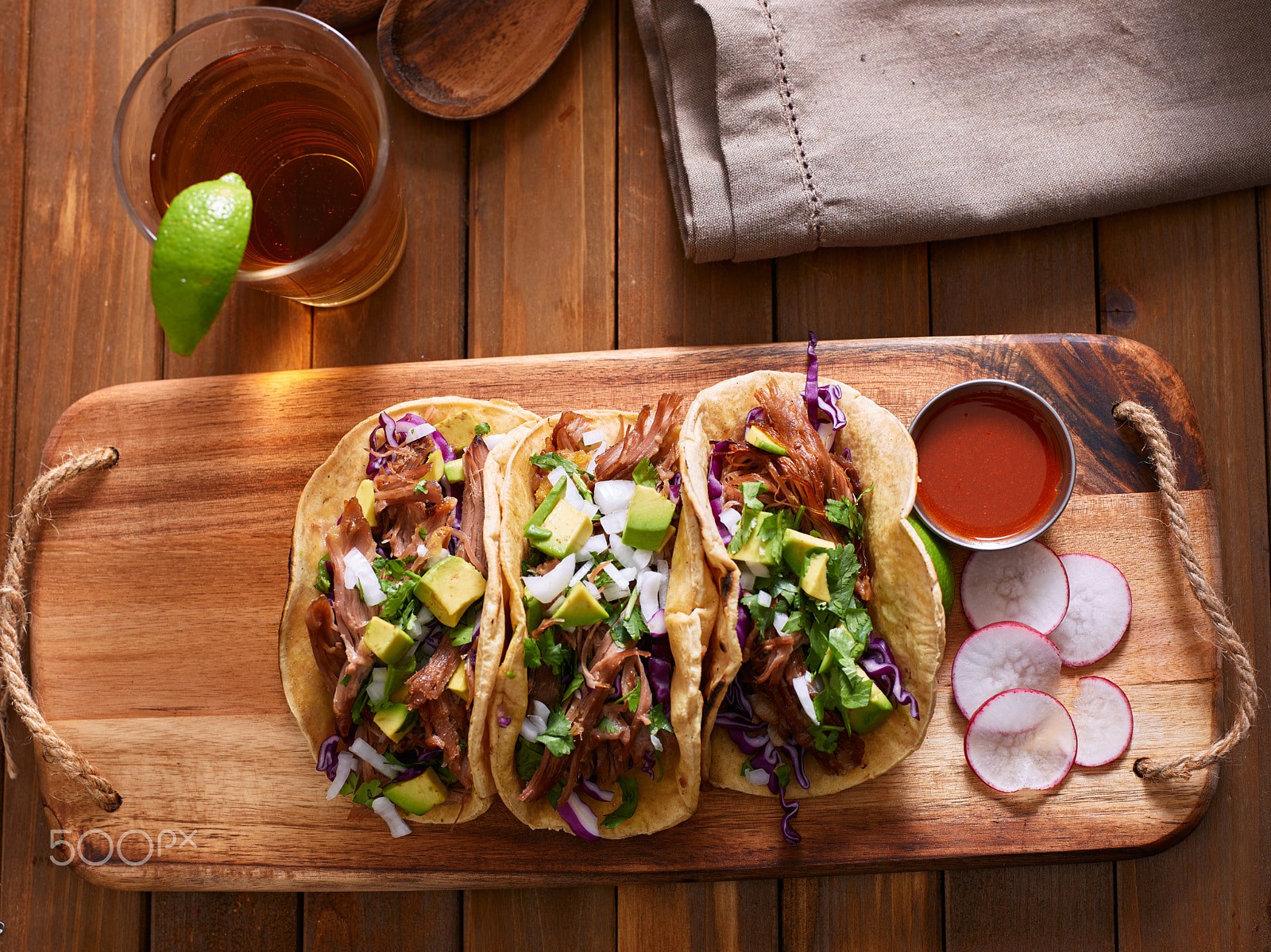 Phase One P65+ sample photo. Exican pork carnitas tacos with beer on wooden tray and radish garnish. photography