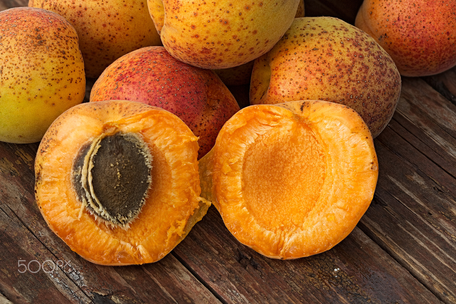 Canon EF 100mm F2.8 Macro USM sample photo. Apricots on a rough wooden background photography