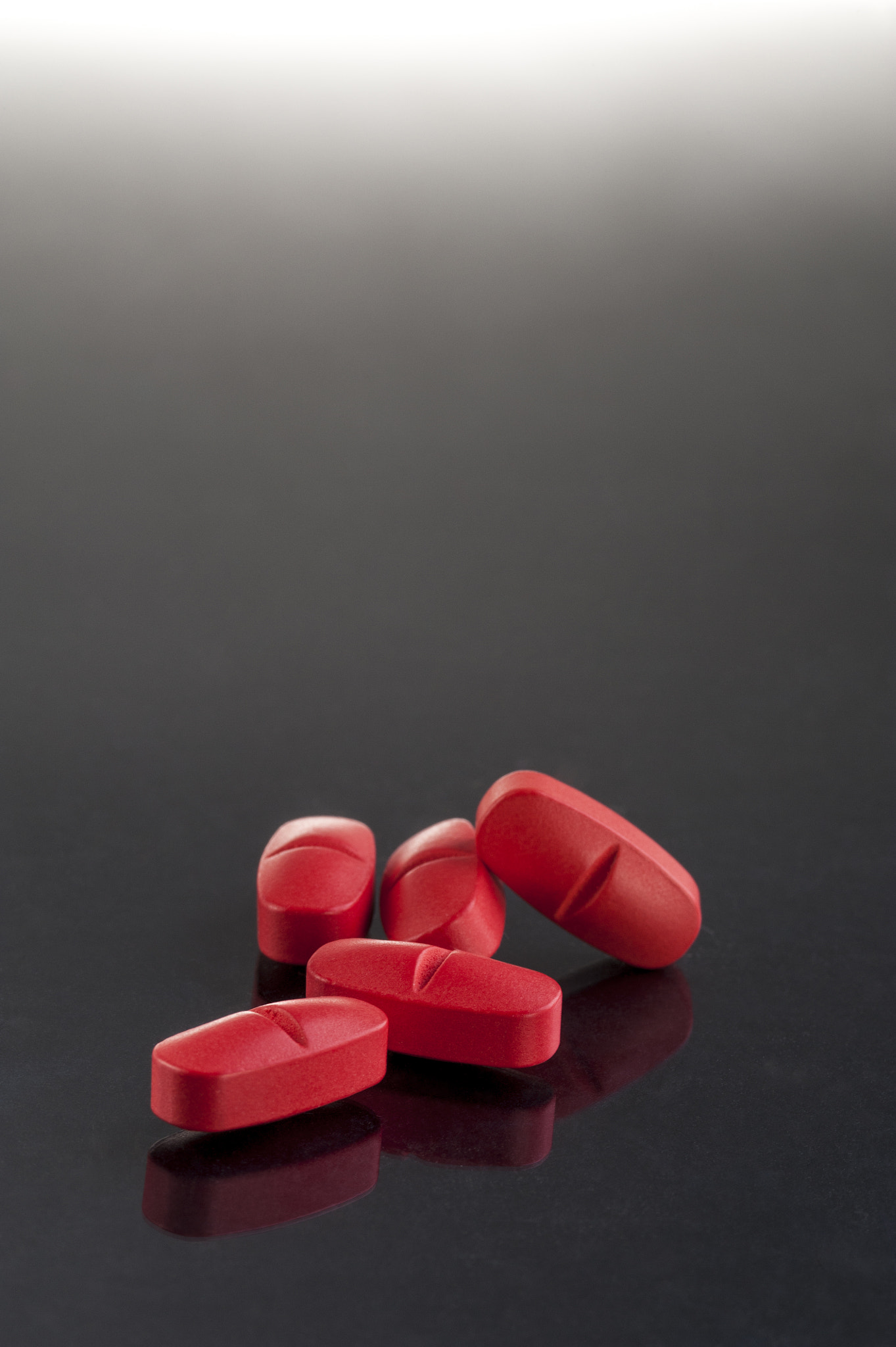 Nikon D700 + AF Micro-Nikkor 105mm f/2.8 sample photo. Red medicine pills photography
