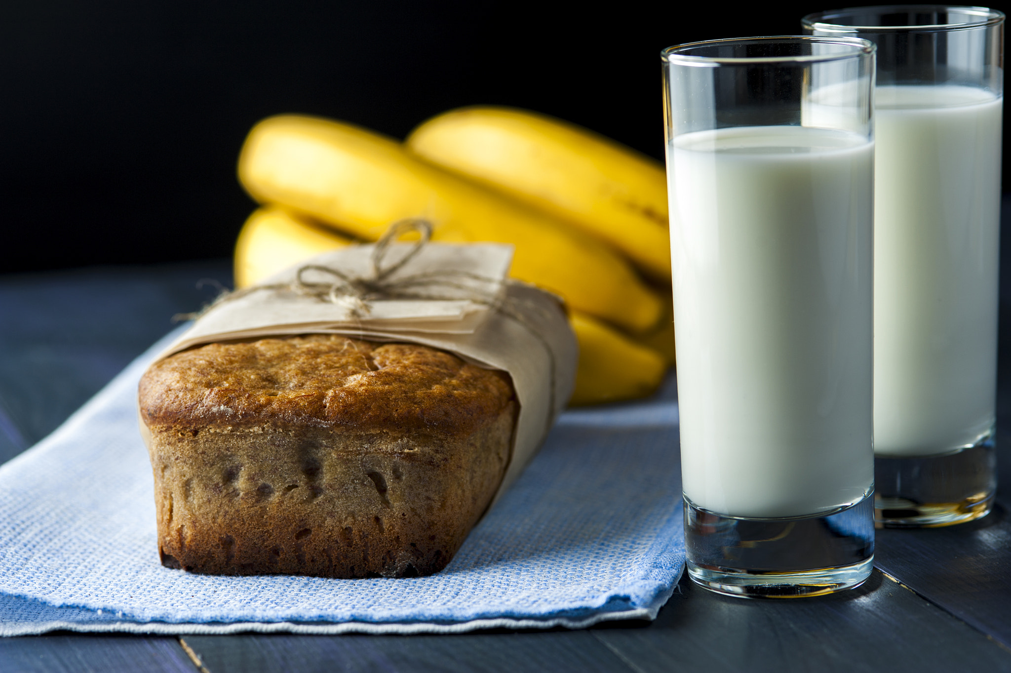 Nikon D700 + AF Micro-Nikkor 105mm f/2.8 sample photo. Banana bread, glasses of milk on burlap napkin photography