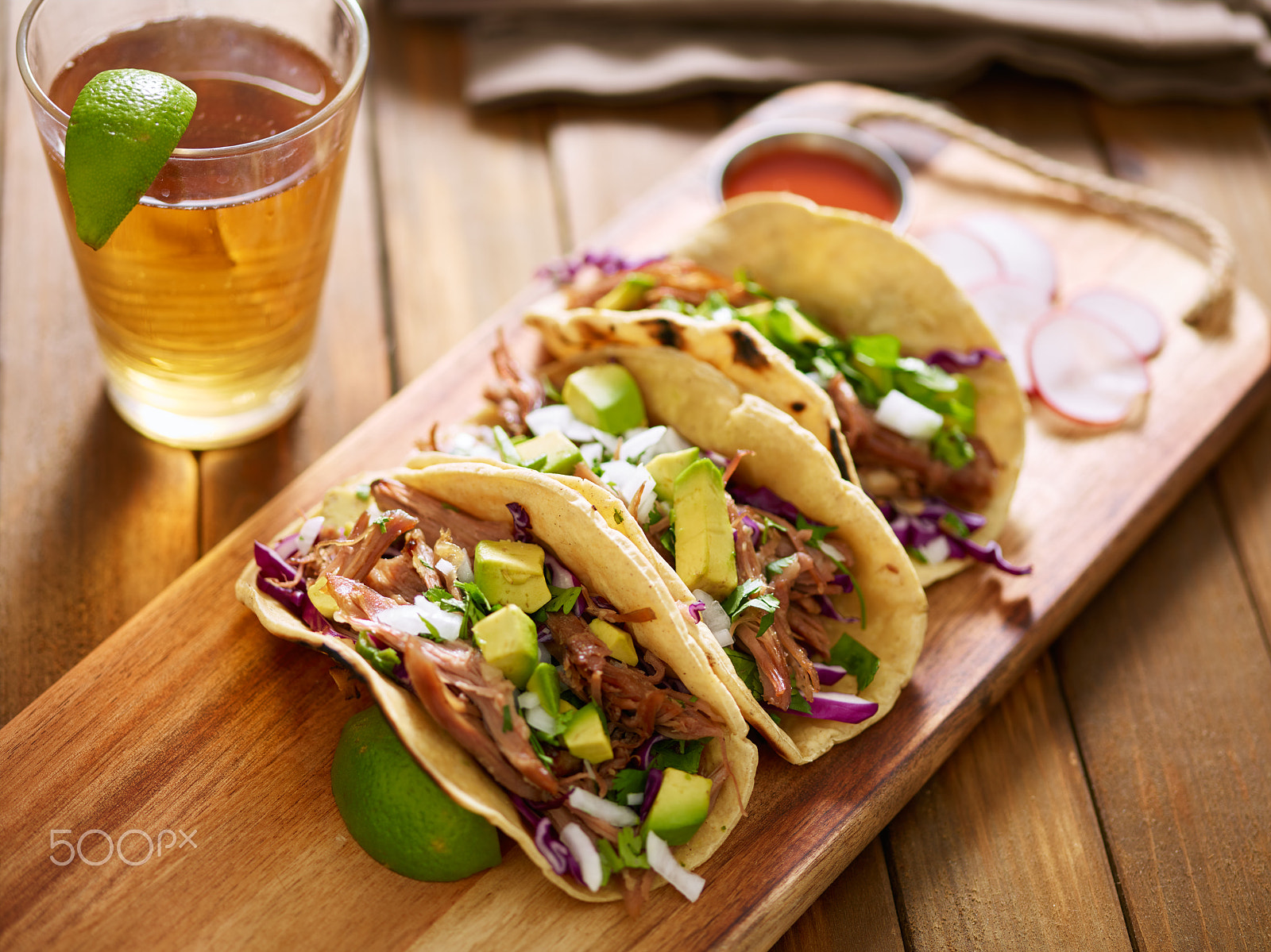 Phase One P65+ sample photo. Three  pork carnitas street tacos in yellow corn tortilla with avocado, onion, cilantro and cabbage photography
