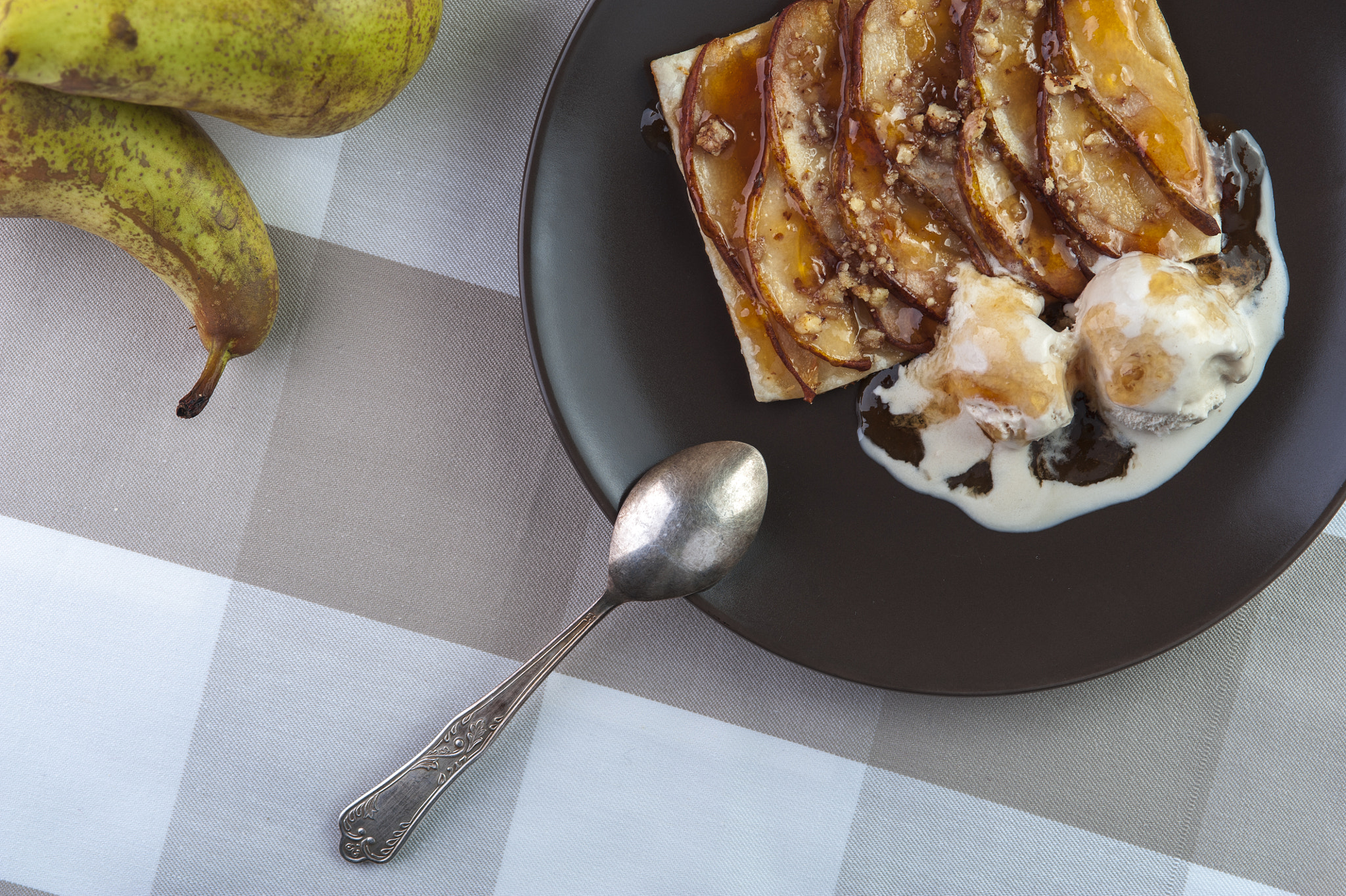 Nikon D700 + AF Micro-Nikkor 105mm f/2.8 sample photo. Tarte with puff pastry, pears, walnuts and ice cream on brown plate and silver spoon photography