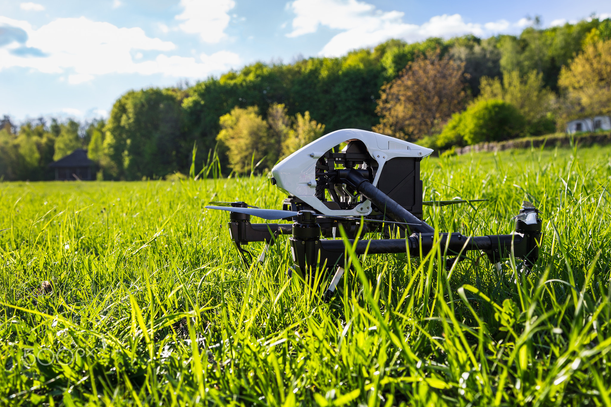 Dron is located in the green grass before takeoff
