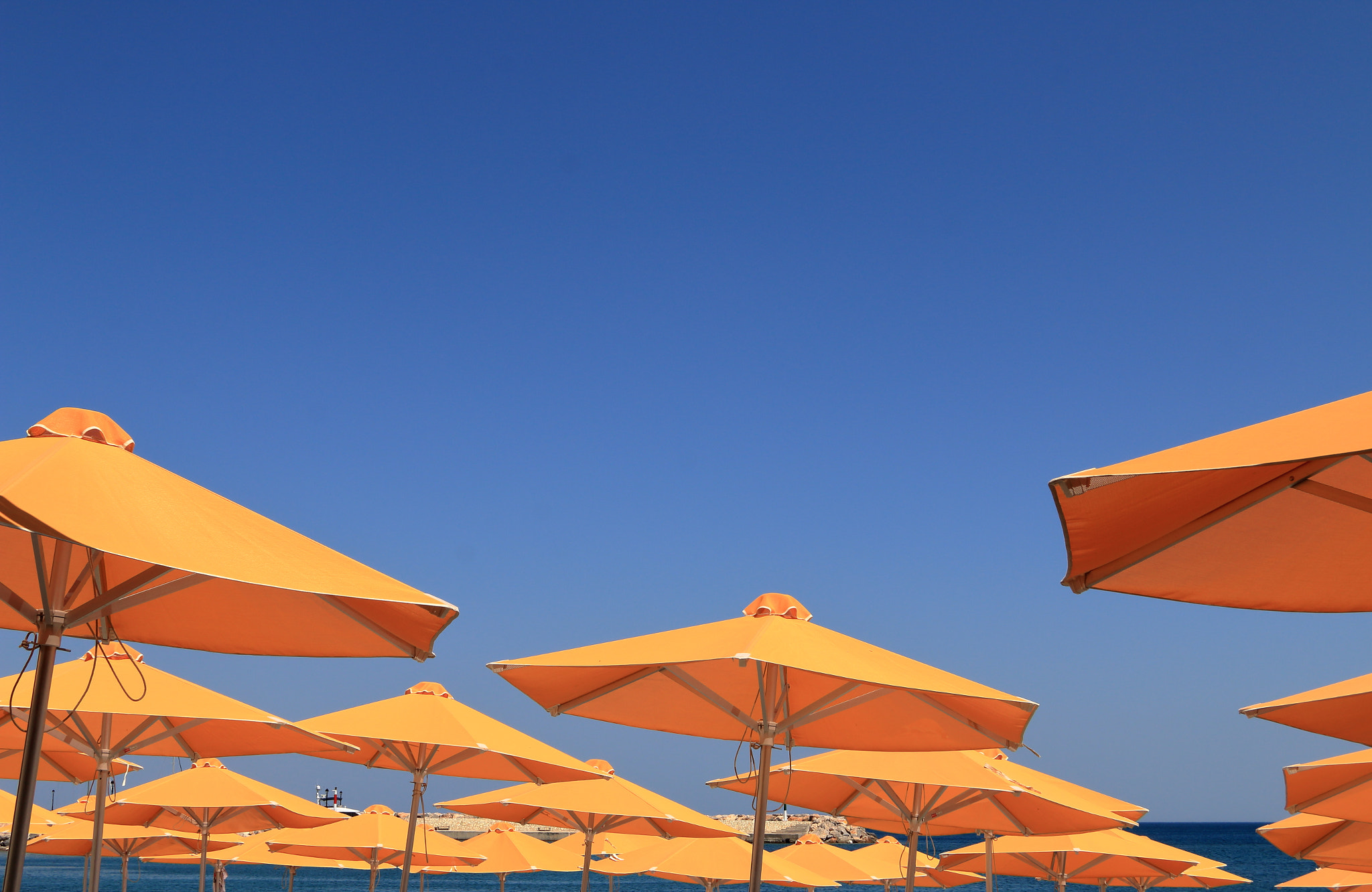 Canon EF 24-85mm F3.5-4.5 USM sample photo. Orange beach umbrellas photography