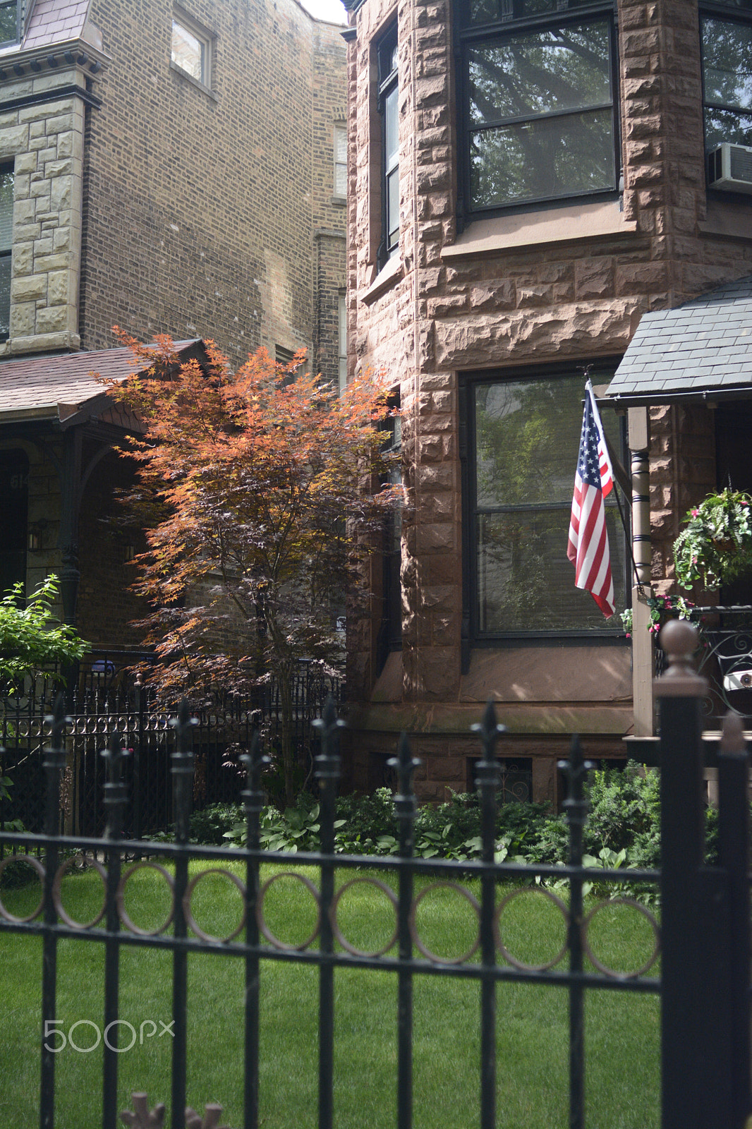 Nikon D7100 + AF Nikkor 28mm f/2.8 sample photo. Chicago architecture with american flag photography