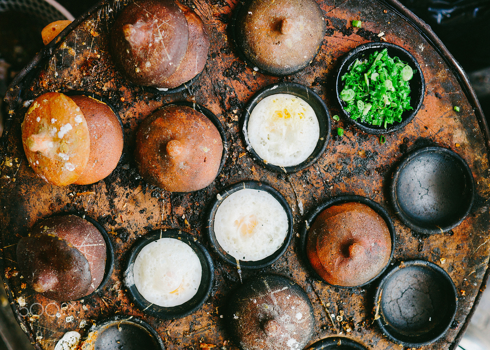 Sony a99 II + Sony 35mm F1.4 G sample photo. The cooking pan of vietnamese food, banh can photography