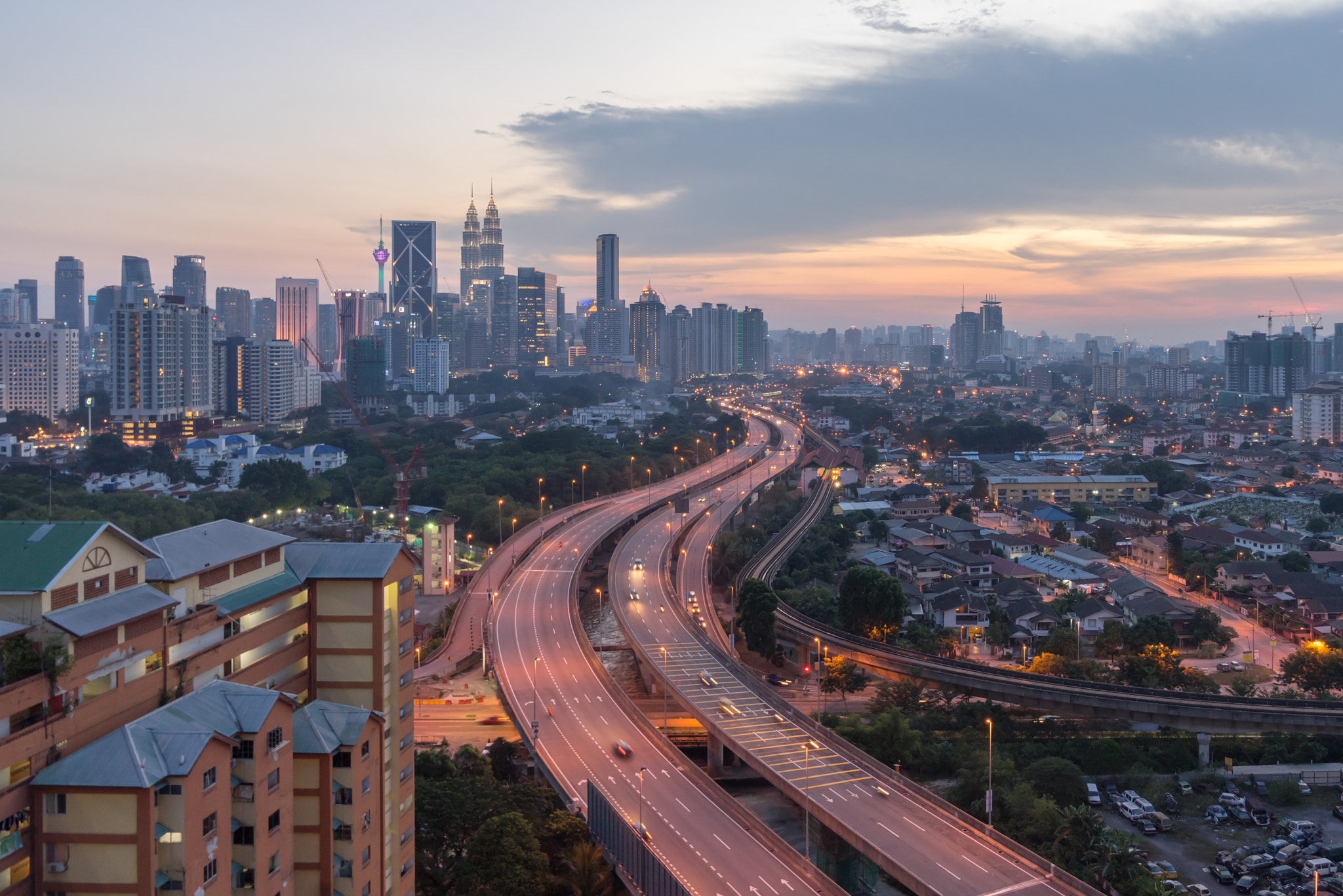 Sony a7R + Sony FE 24-70mm F2.8 GM sample photo. Dramatic sunset over kuala lumpur city skyline photography