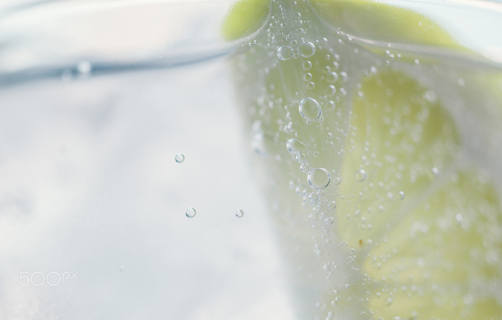 Nikon D610 + Sigma 50mm F2.8 EX DG Macro sample photo. Gin tonic close up, macro inside a glass with lemon, ice and bub photography