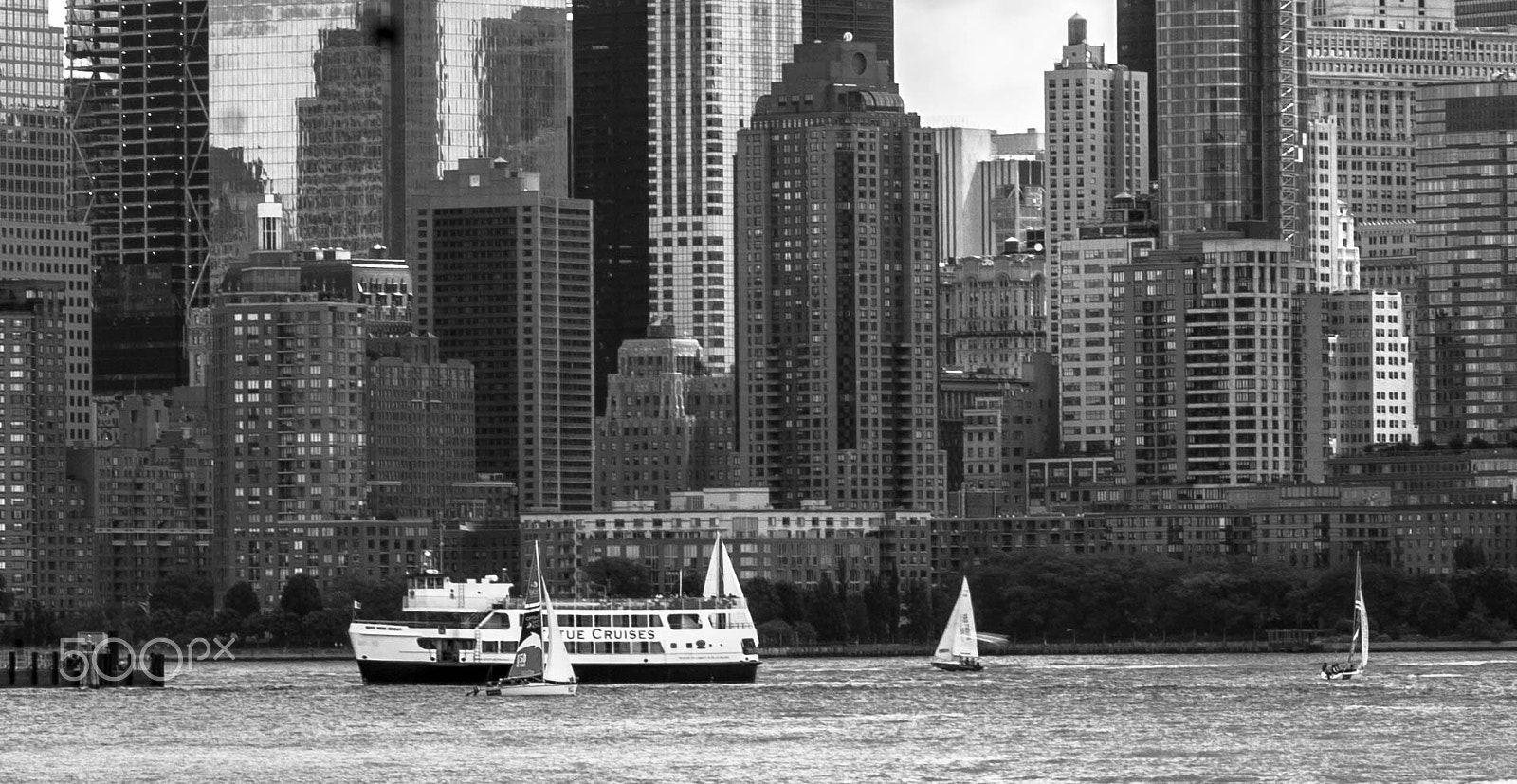 Sony a99 II + Minolta AF 80-200mm F2.8 HS-APO G sample photo. New york in summer with statue cruise boat photography
