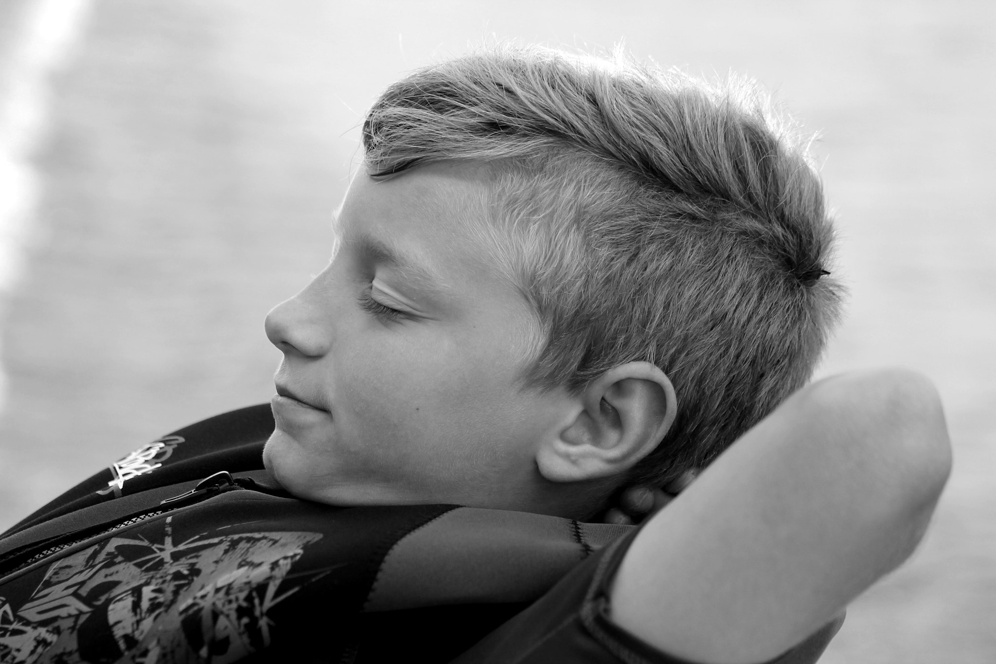Canon EF75-300mm f/4-5.6 sample photo. My son relaxing on a boat photography