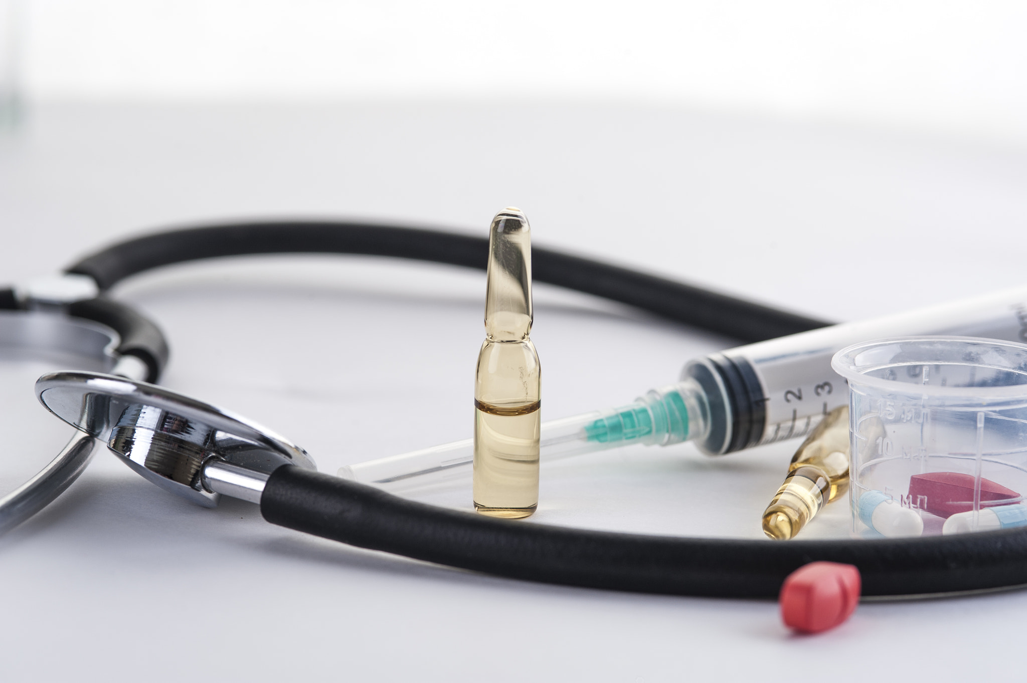 AF Micro-Nikkor 105mm f/2.8 sample photo. Stethoscope, syringe for injection, ampules and pi photography