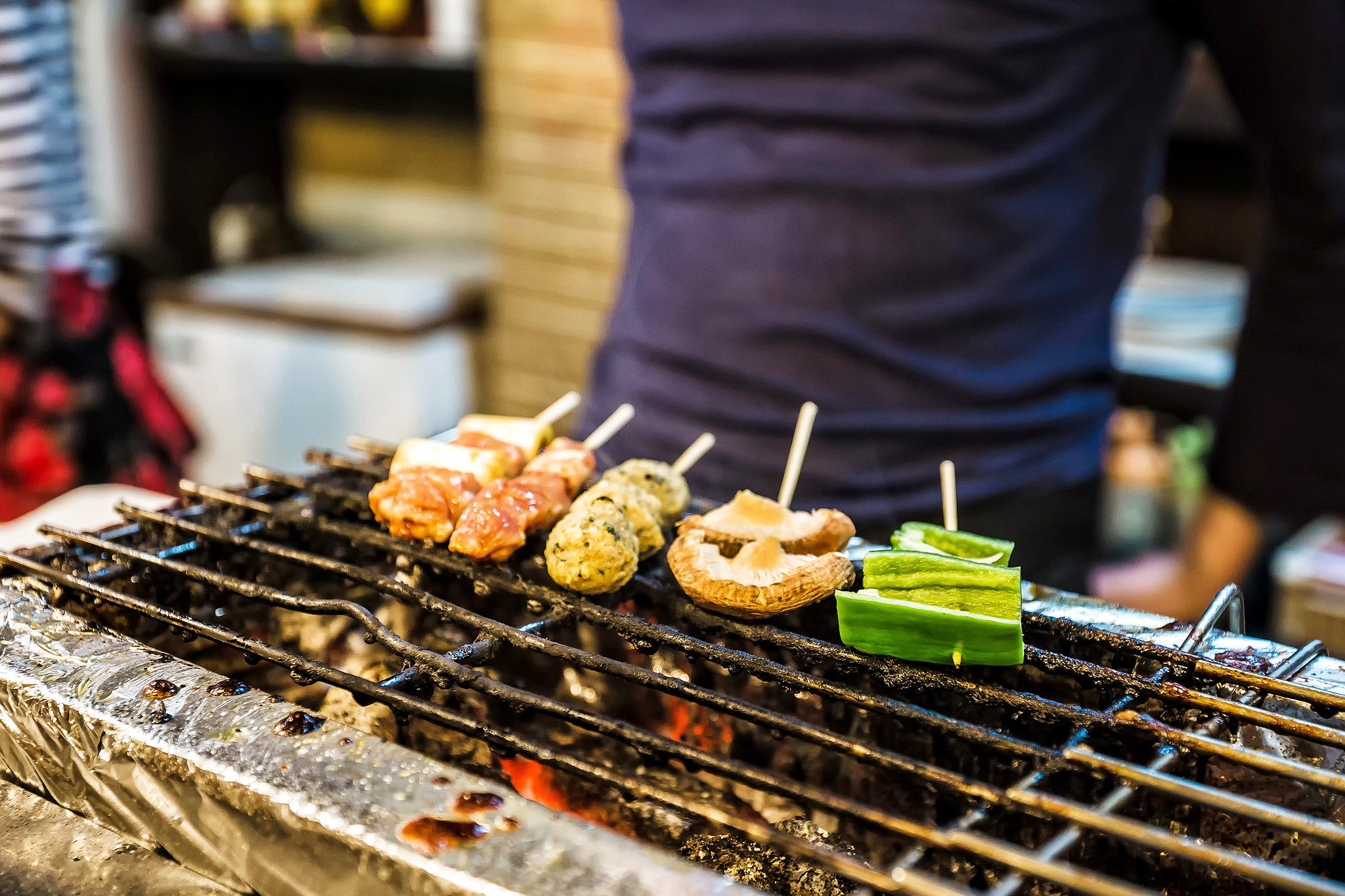 Sony a99 II + Sony Vario-Sonnar T* 16-35mm F2.8 ZA SSM sample photo. Japanese yakitori on the grill photography