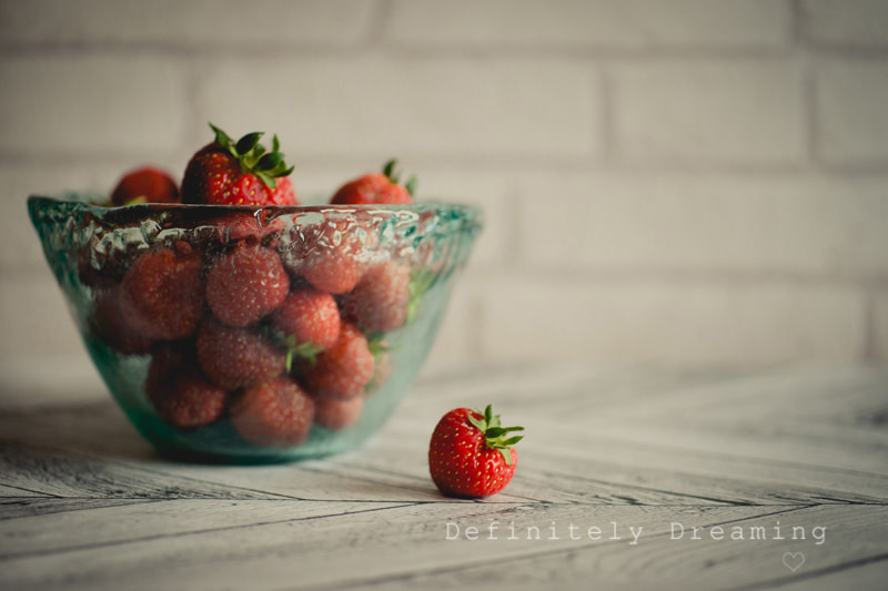 Sony a99 II + Sigma 30mm F1.4 EX DC HSM sample photo. Bowl of strawberries, warm toned photography