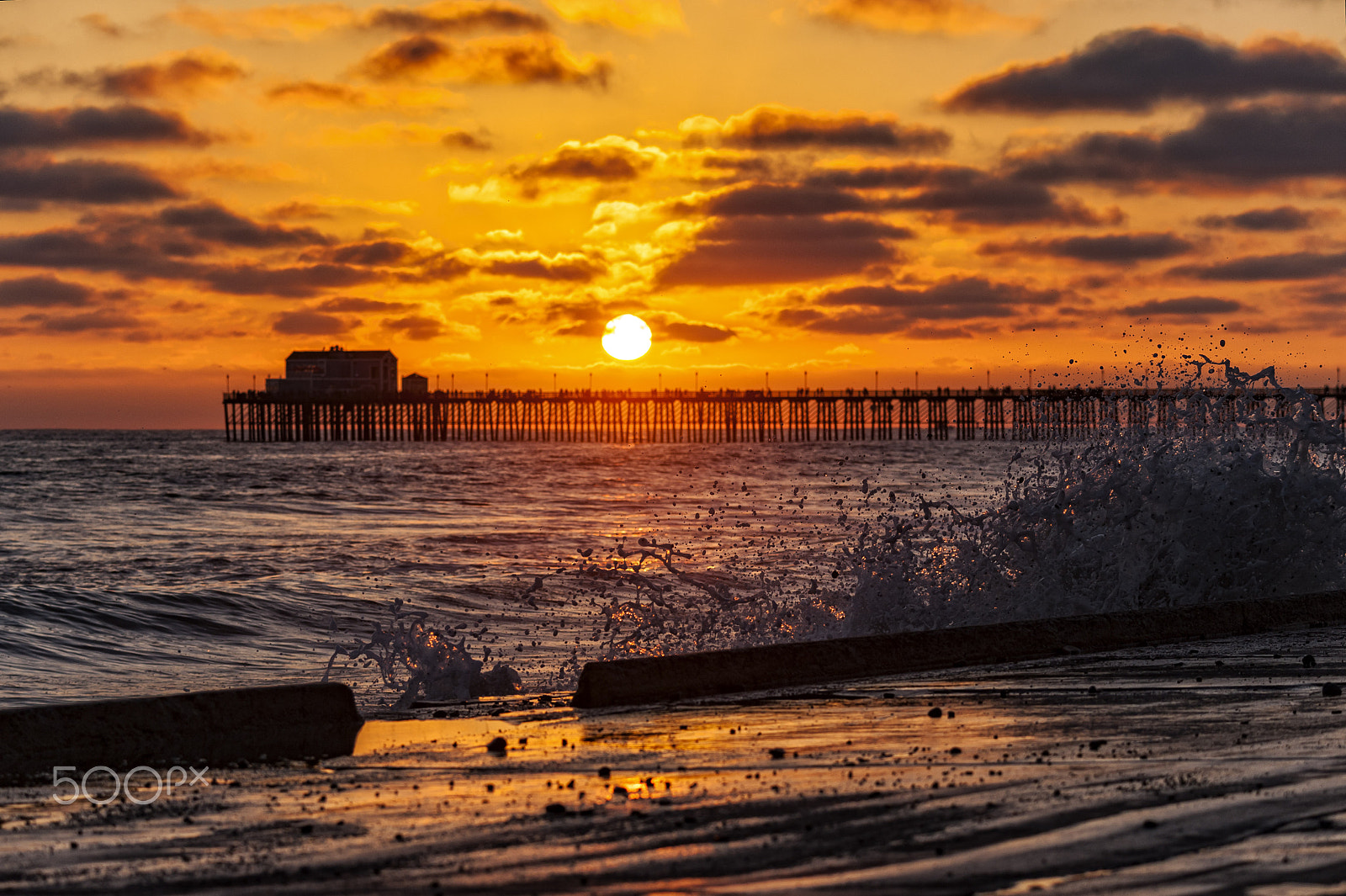 Nikon D700 + Nikon AF-S Nikkor 80-400mm F4.5-5.6G ED VR sample photo. Waves crash on the oceanside strand at sunset photography