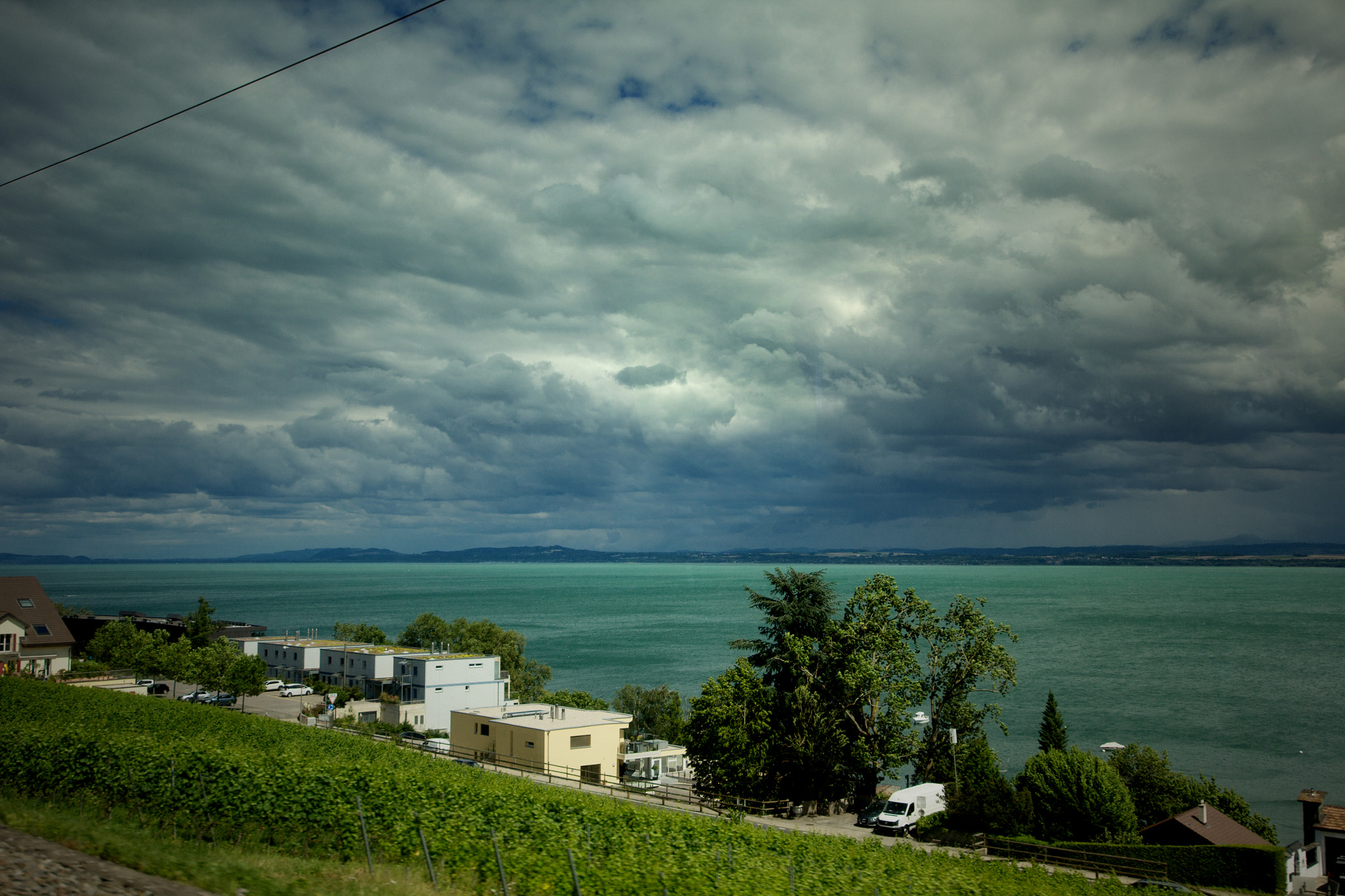 Sigma 12-24mm F4.5-5.6 II DG HSM sample photo. View from the train on neuchâtel's lake photography