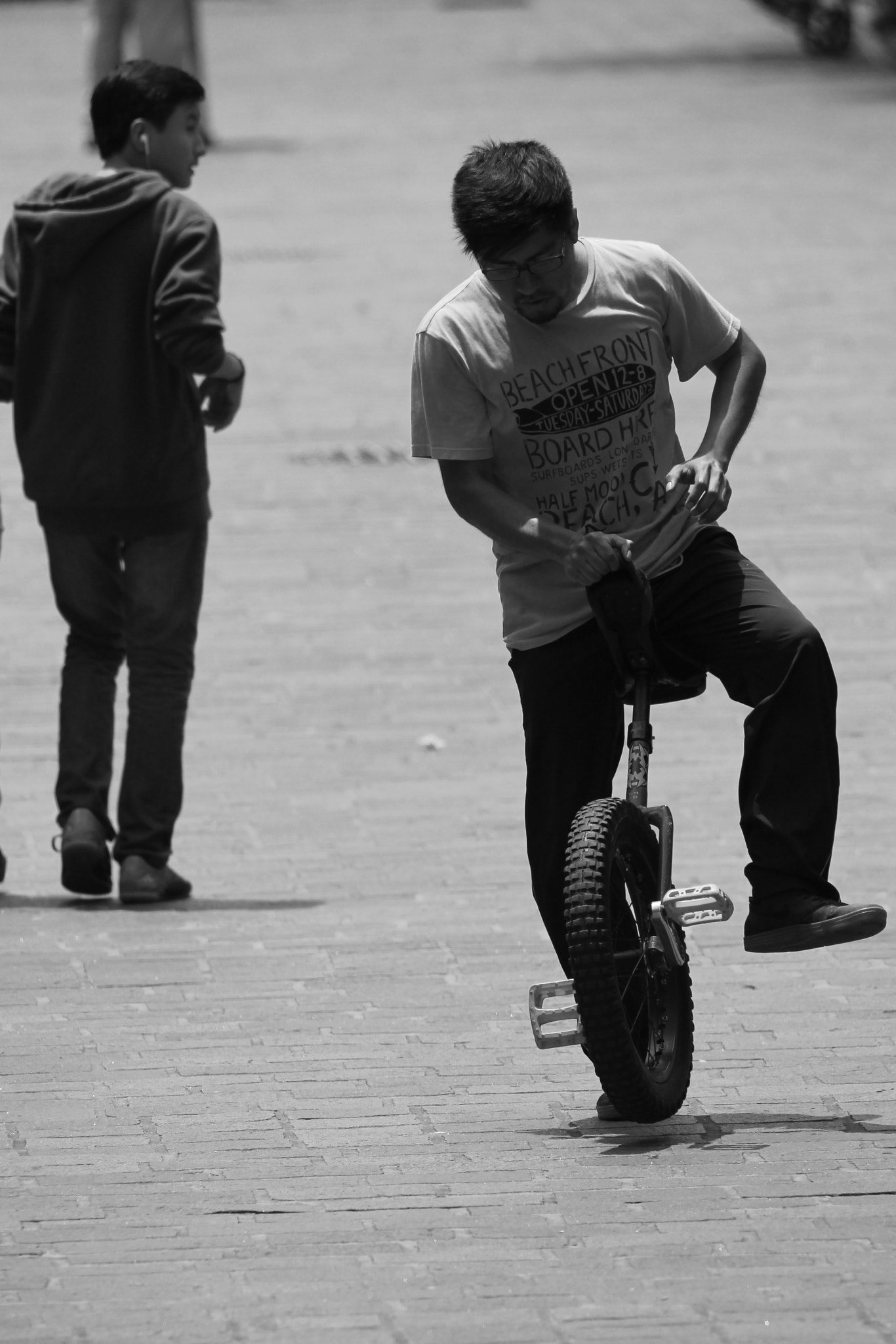 Canon 150-500mm sample photo. Adolescent riding monocycle photography