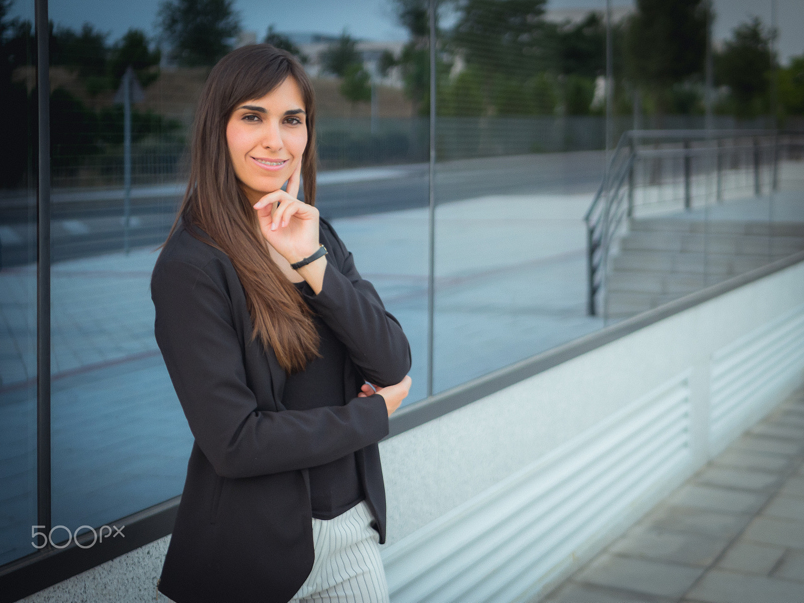 Panasonic Lumix DMC-GH3 + LUMIX G 25/F1.7 sample photo. Young business woman outside office photography