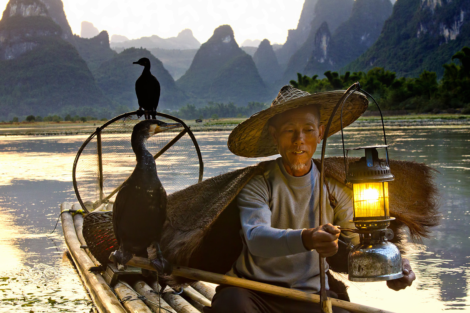 Canon EOS 60D + EF28-70mm f/2.8L USM sample photo. Cormorant fisherman at sunset - li river #3 photography