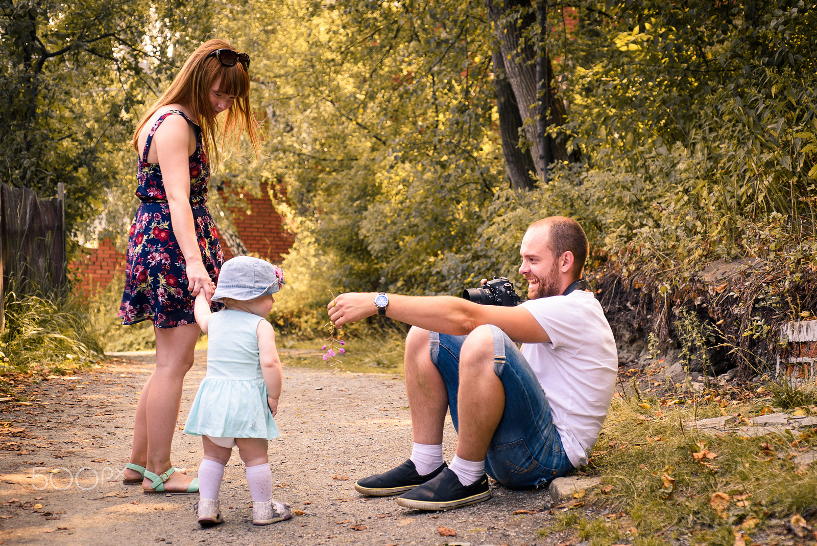 Nikon D750 + AF Micro-Nikkor 60mm f/2.8 sample photo. Summer holidays, children and people concept - happy family with camera, green grass taking picture photography