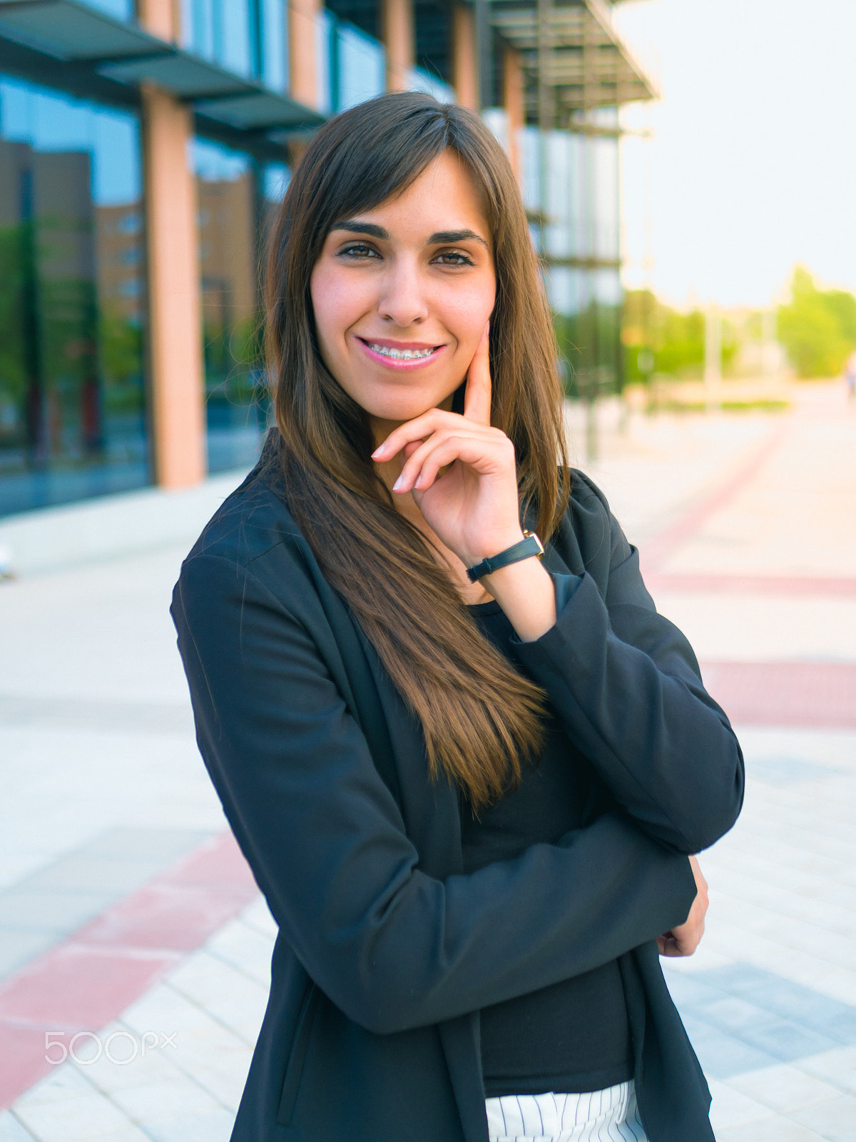 Panasonic Lumix DMC-GH3 + LUMIX G 25/F1.7 sample photo. Young business woman posing in front office photography