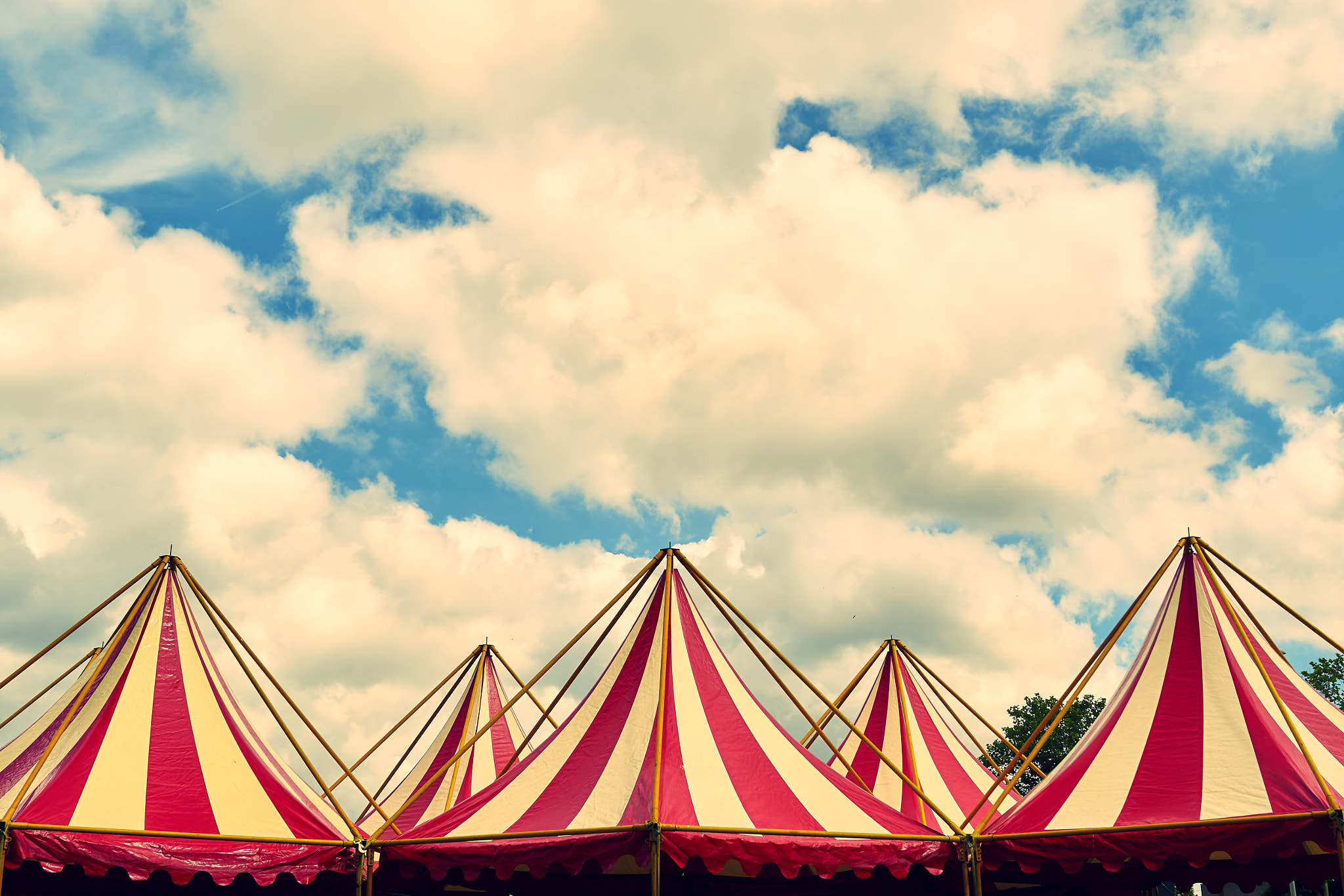 Sony ILCA-77M2 + 24mm F2.8 sample photo. Tents against a cloudy sky photography