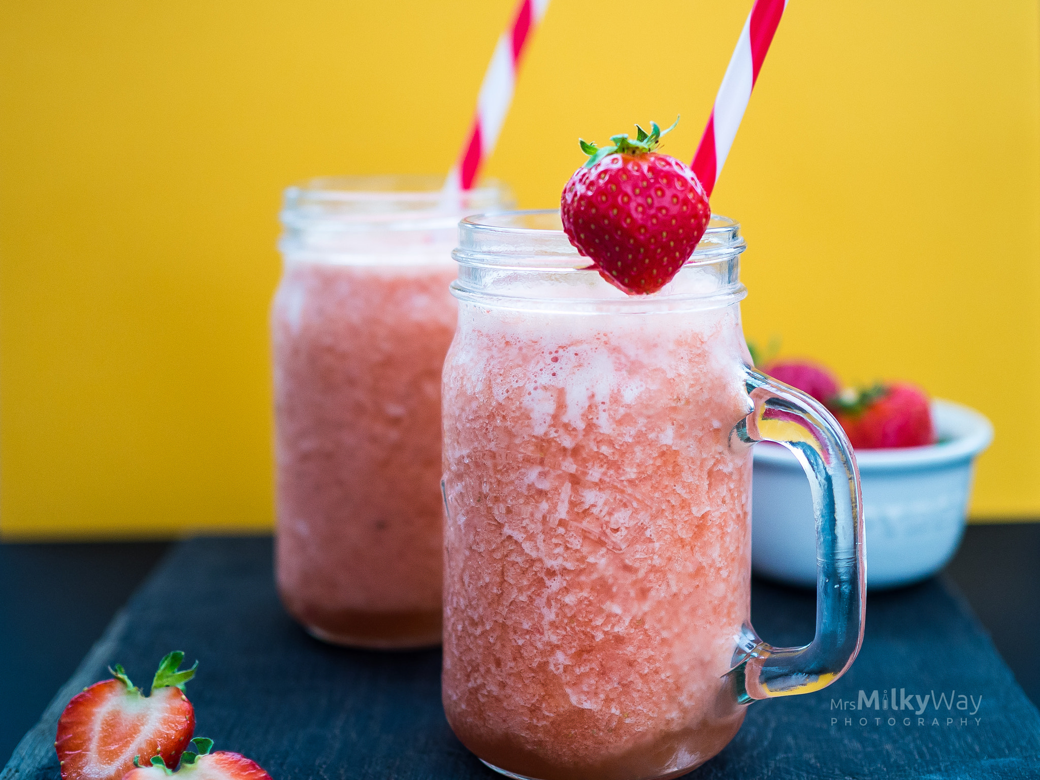 Olympus OM-D E-M10 II + Olympus M.Zuiko Digital 25mm F1.8 sample photo. Strawberry smoothie on a yellow background photography