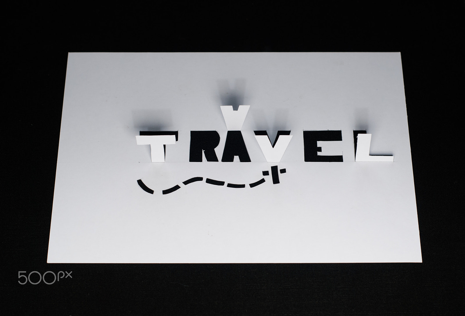 Nikon D80 + AF Nikkor 50mm f/1.8 N sample photo. The word travel cut from paper, photography