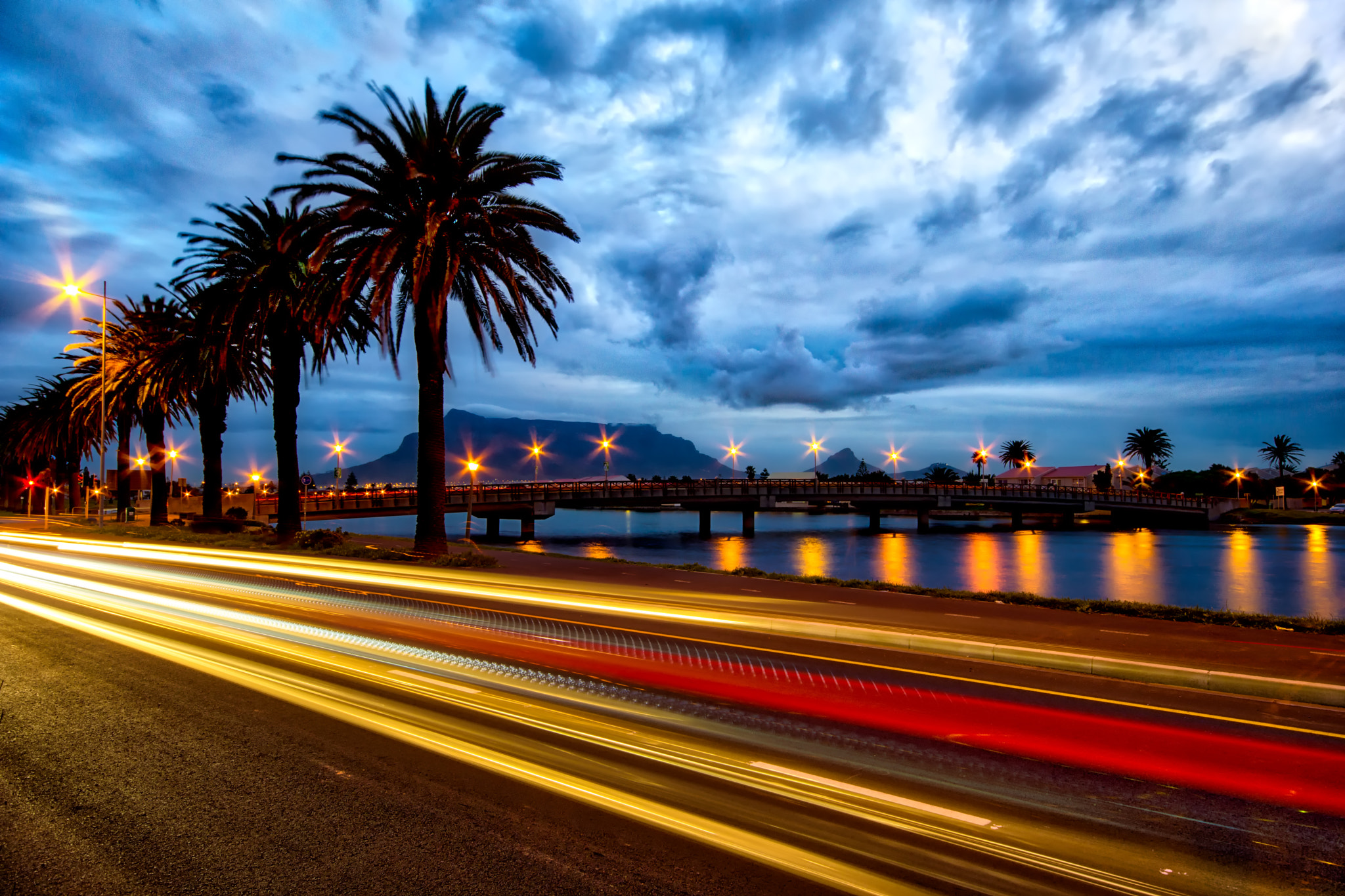 Minolta AF 28-80mm F3.5-5.6 II sample photo. Light trails with table mountain in the background ... photography