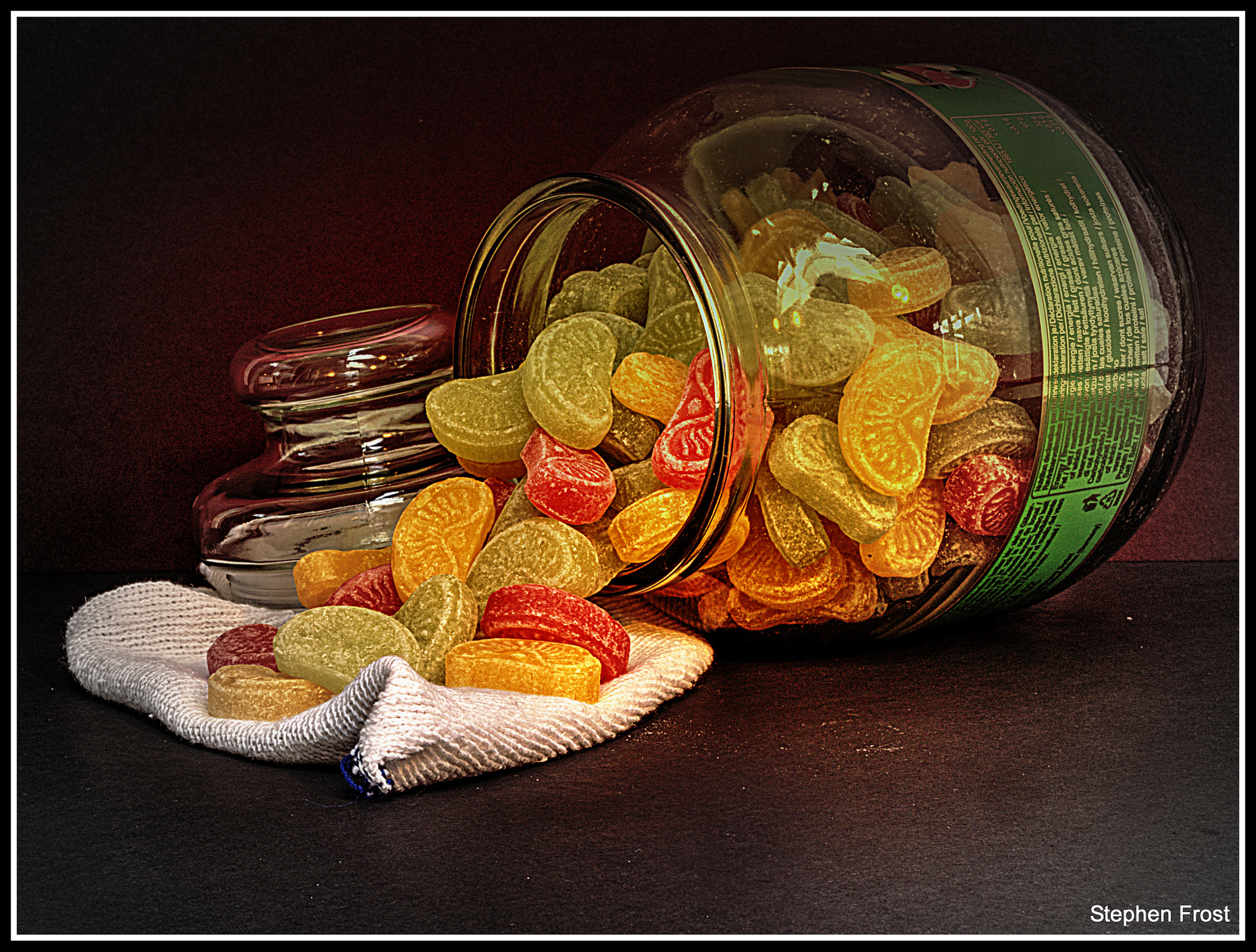 Olympus PEN E-PL5 + Olympus M.Zuiko Digital ED 12-40mm F2.8 Pro sample photo. Boiled sweets spilling from the jar photography