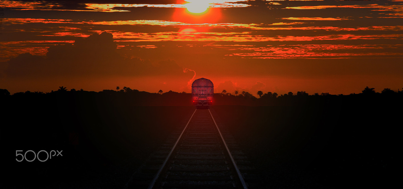 Canon EF 8-15mm F4L Fisheye USM sample photo. Tracks into sunset photography