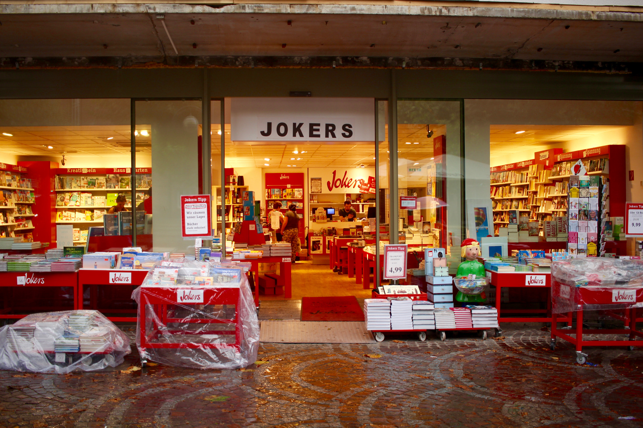 Canon EF-S 24mm F2.8 STM sample photo. Bookstore in the rain photography