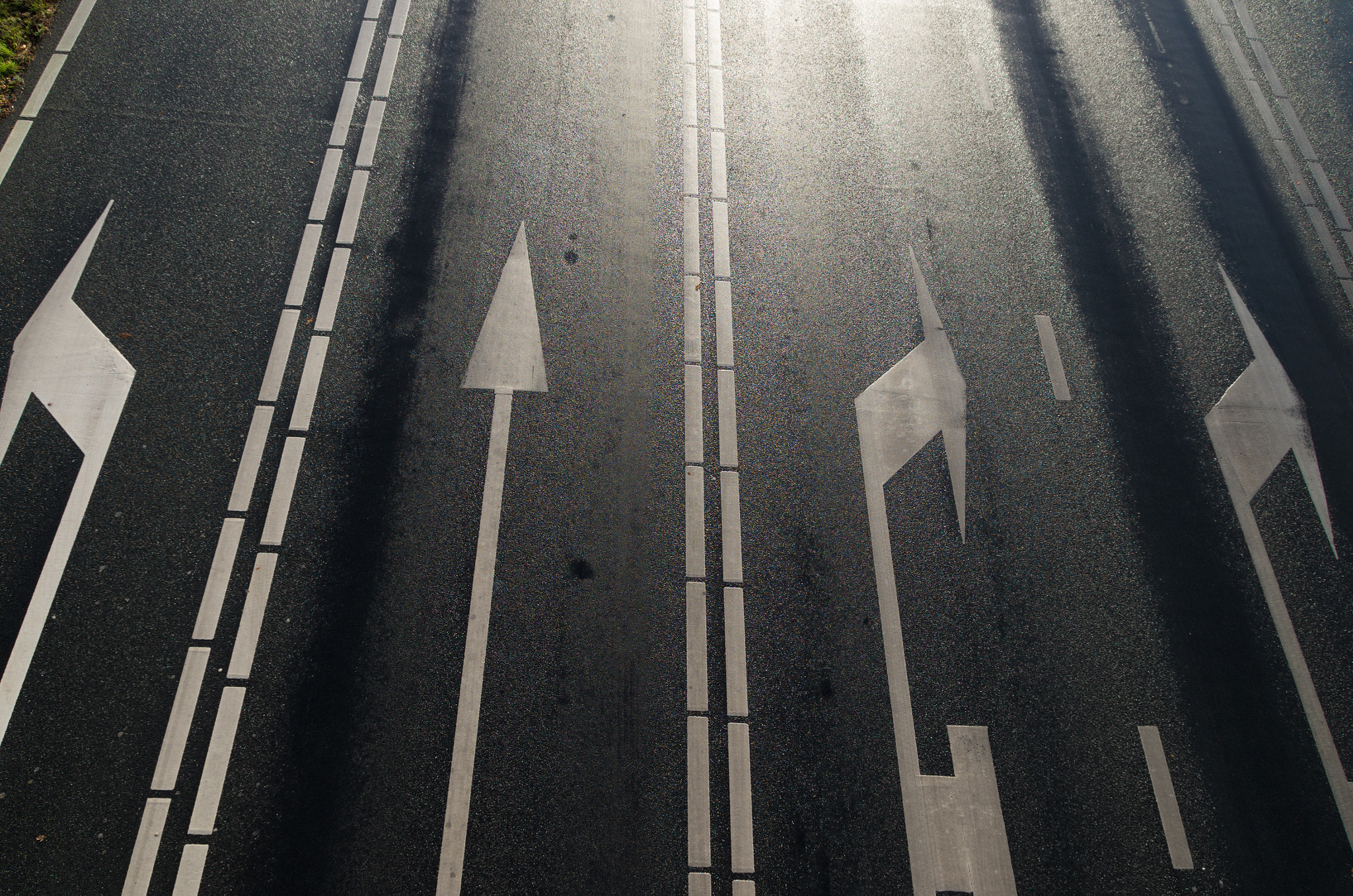 Pentax K-5 IIs sample photo. Arrows on asphalt road photography