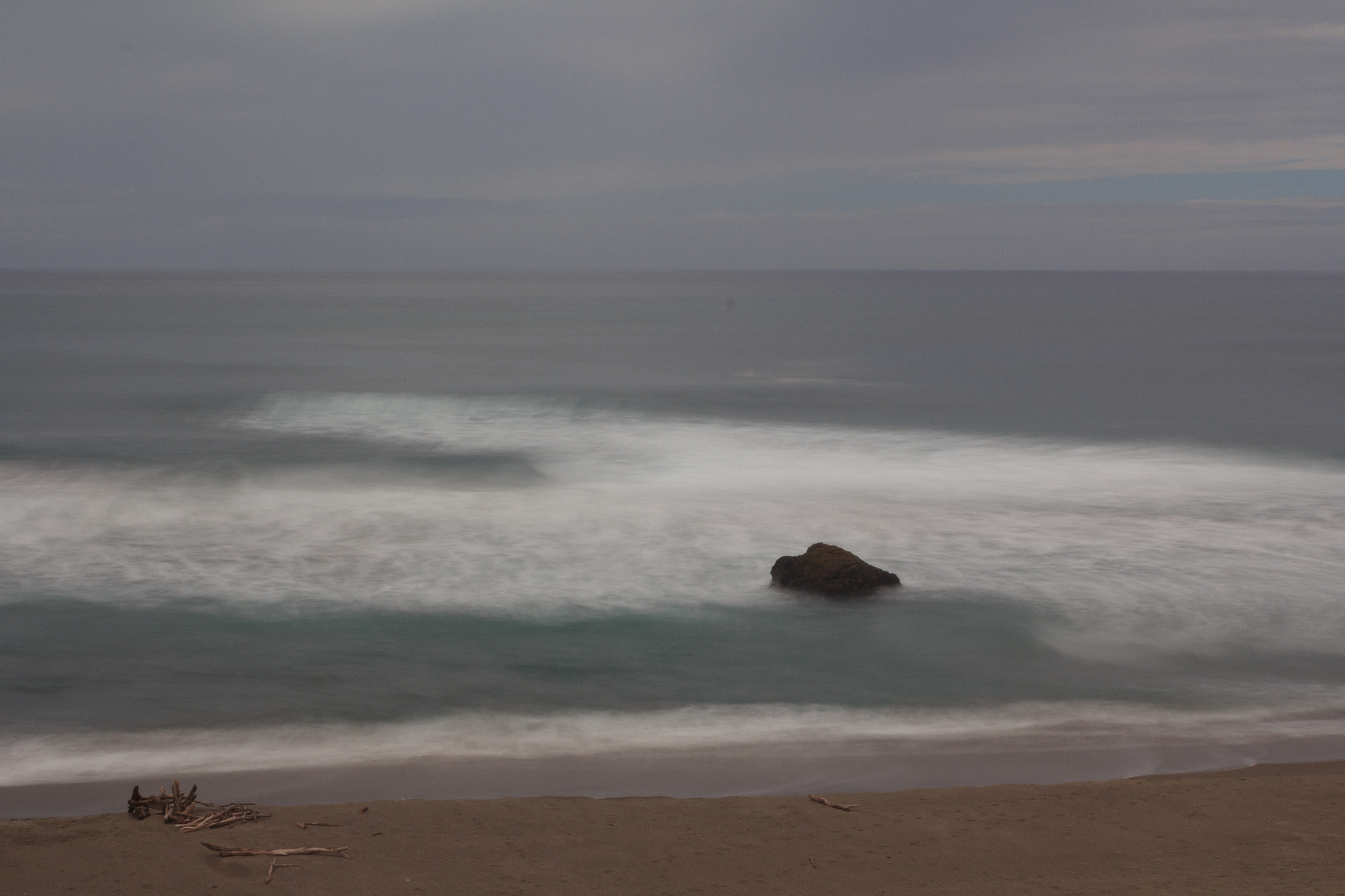 Canon EF 28-105mm f/3.5-4.5 USM sample photo. Rock in the surf photography