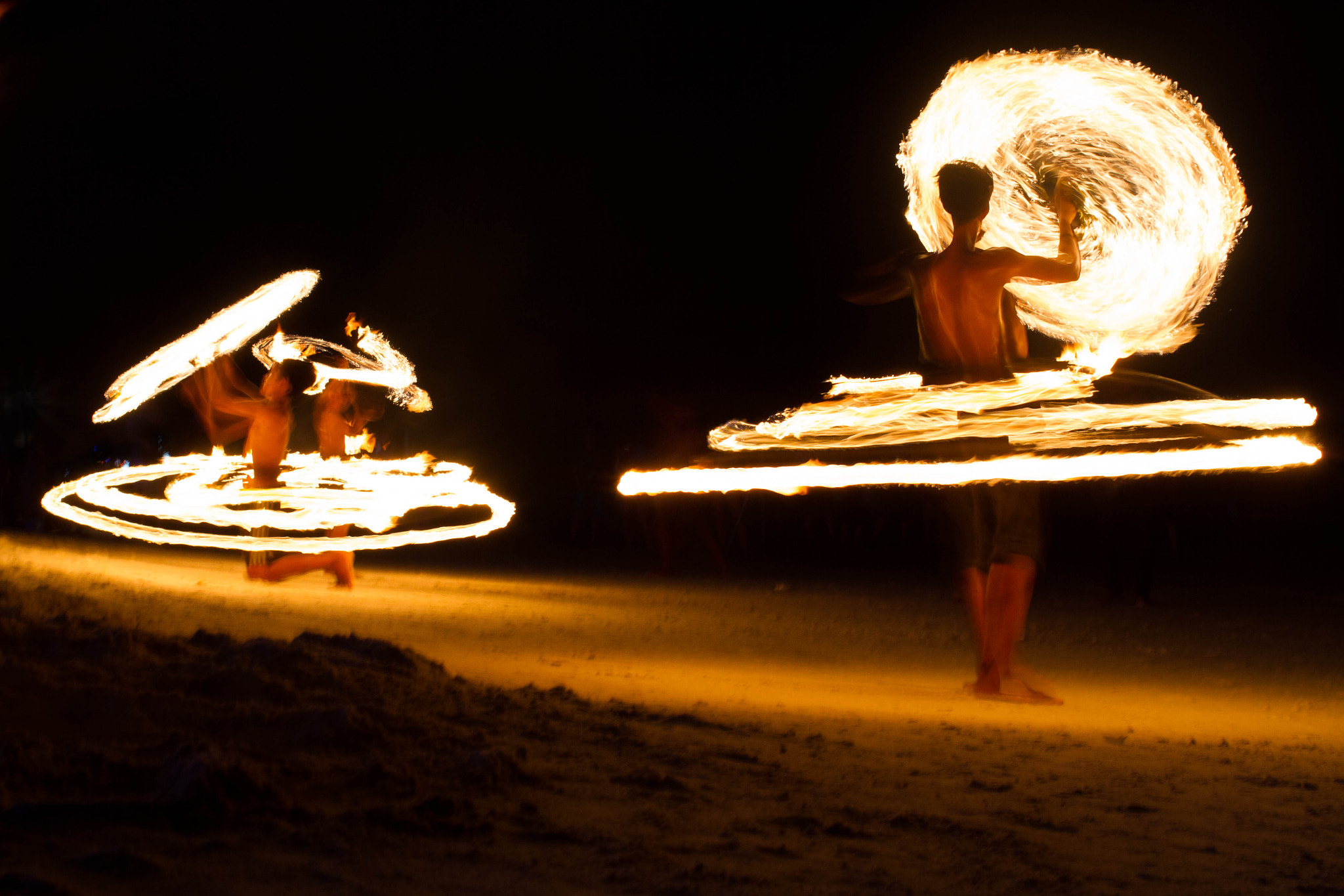 Canon EOS 7D + Canon EF 35mm F2 sample photo. Fire dancers photography