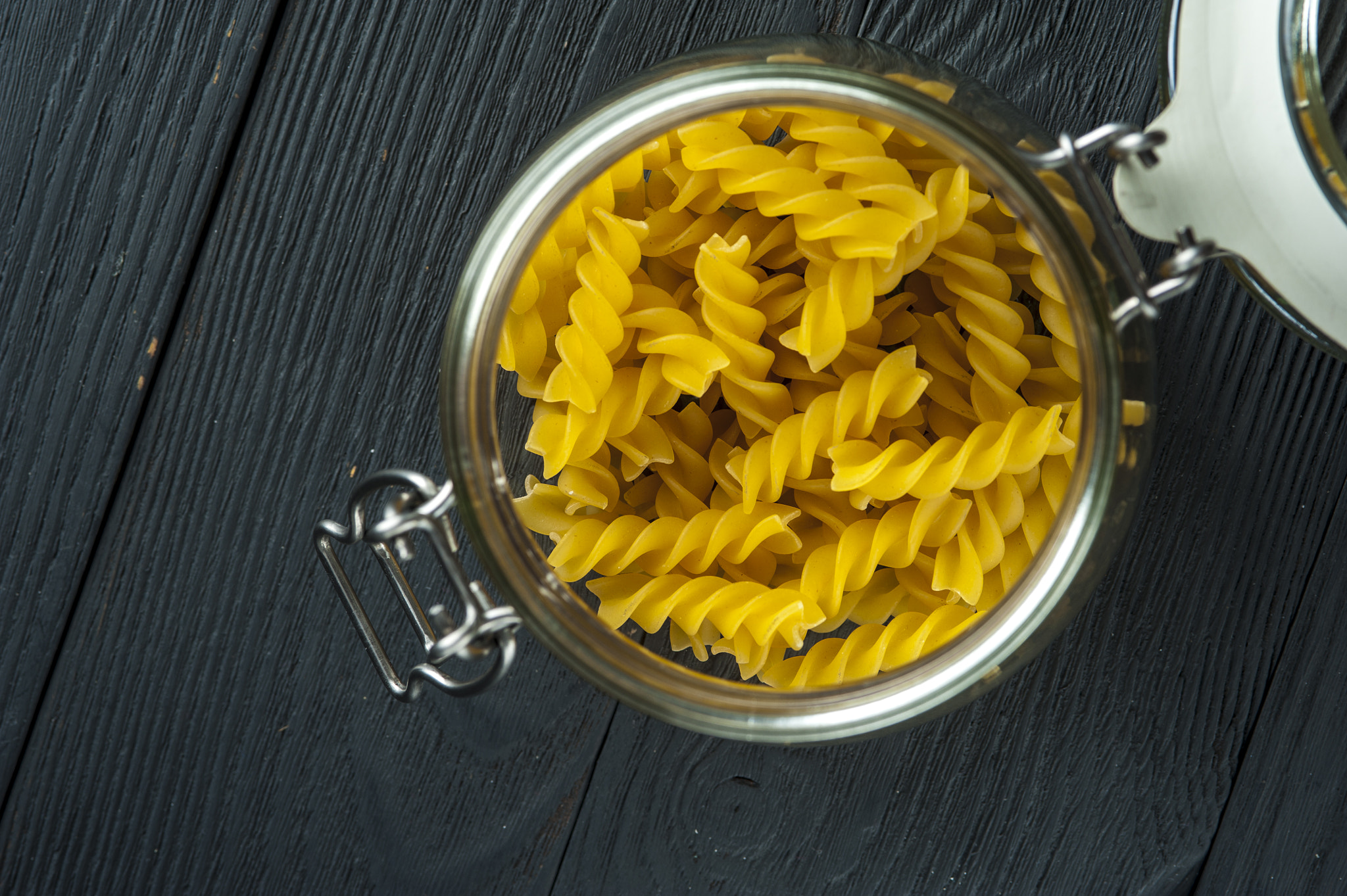 Nikon D700 + AF Micro-Nikkor 105mm f/2.8 sample photo. Pasta fusilli in a jar on wooden background. italian cuisine. photography