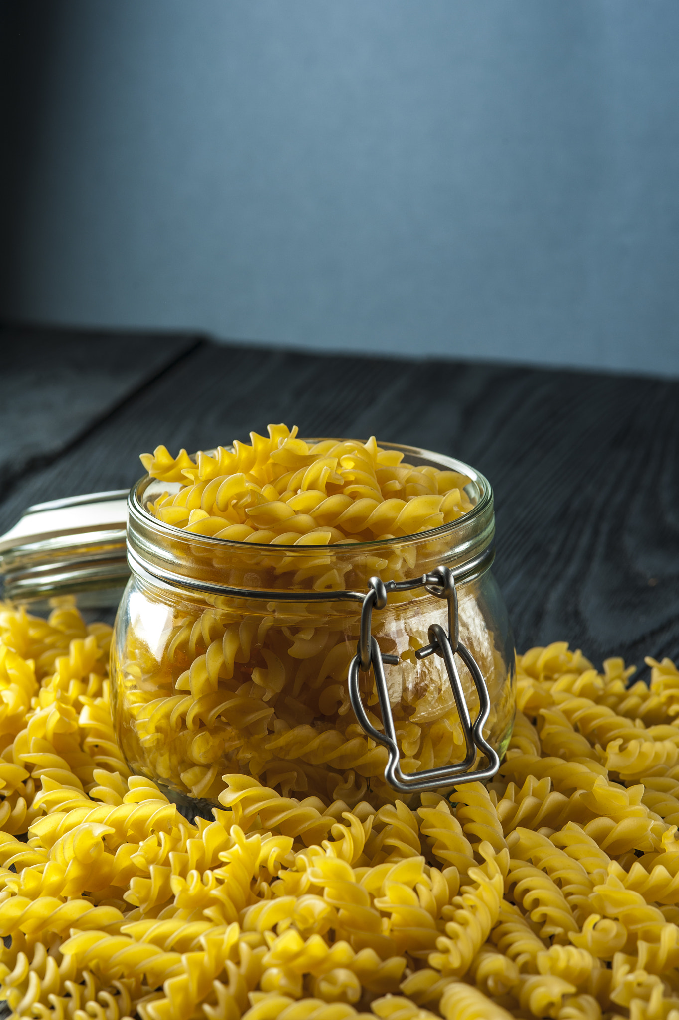 Nikon D700 + AF Micro-Nikkor 105mm f/2.8 sample photo. Pasta fusilli in a jar on wooden background. italian cuisine. photography