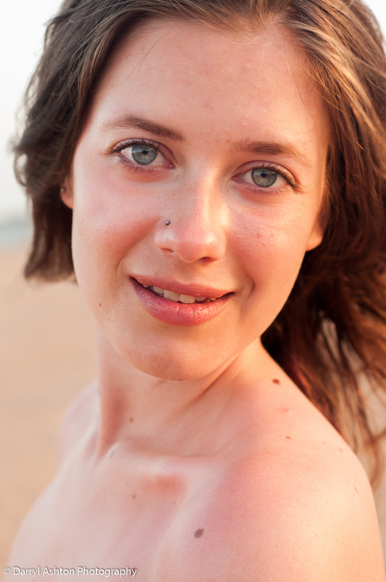 Nikon D300S + AF Nikkor 50mm f/1.8 sample photo. Smiles and shoulders on a beach at sunset photography