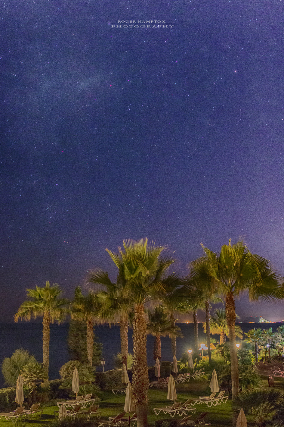 Sigma 24mm F1.4 DG HSM Art sample photo. Lights over a distant rock photography