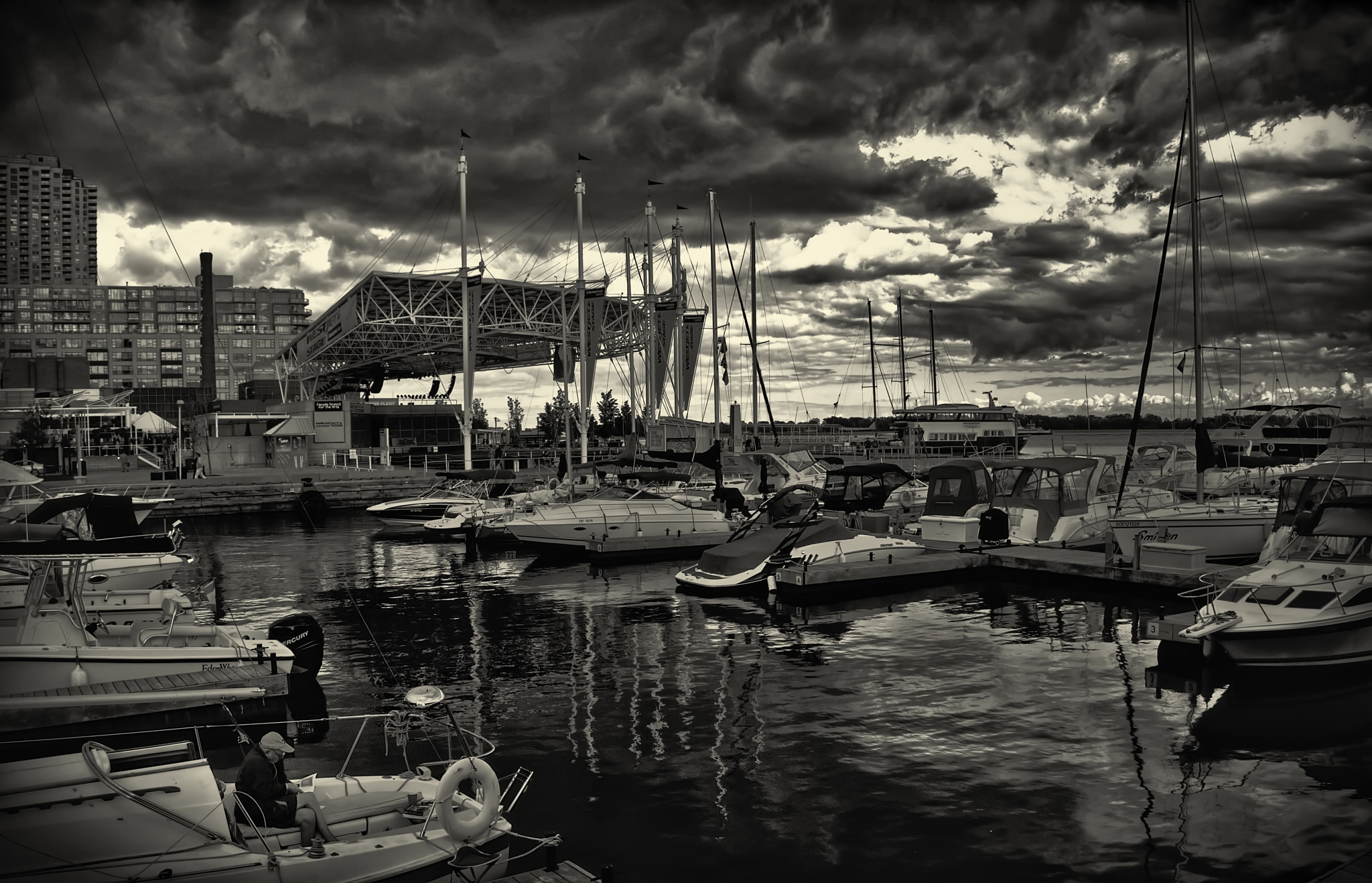 Olympus PEN E-P1 sample photo. The  lone sailor in the harbor photography