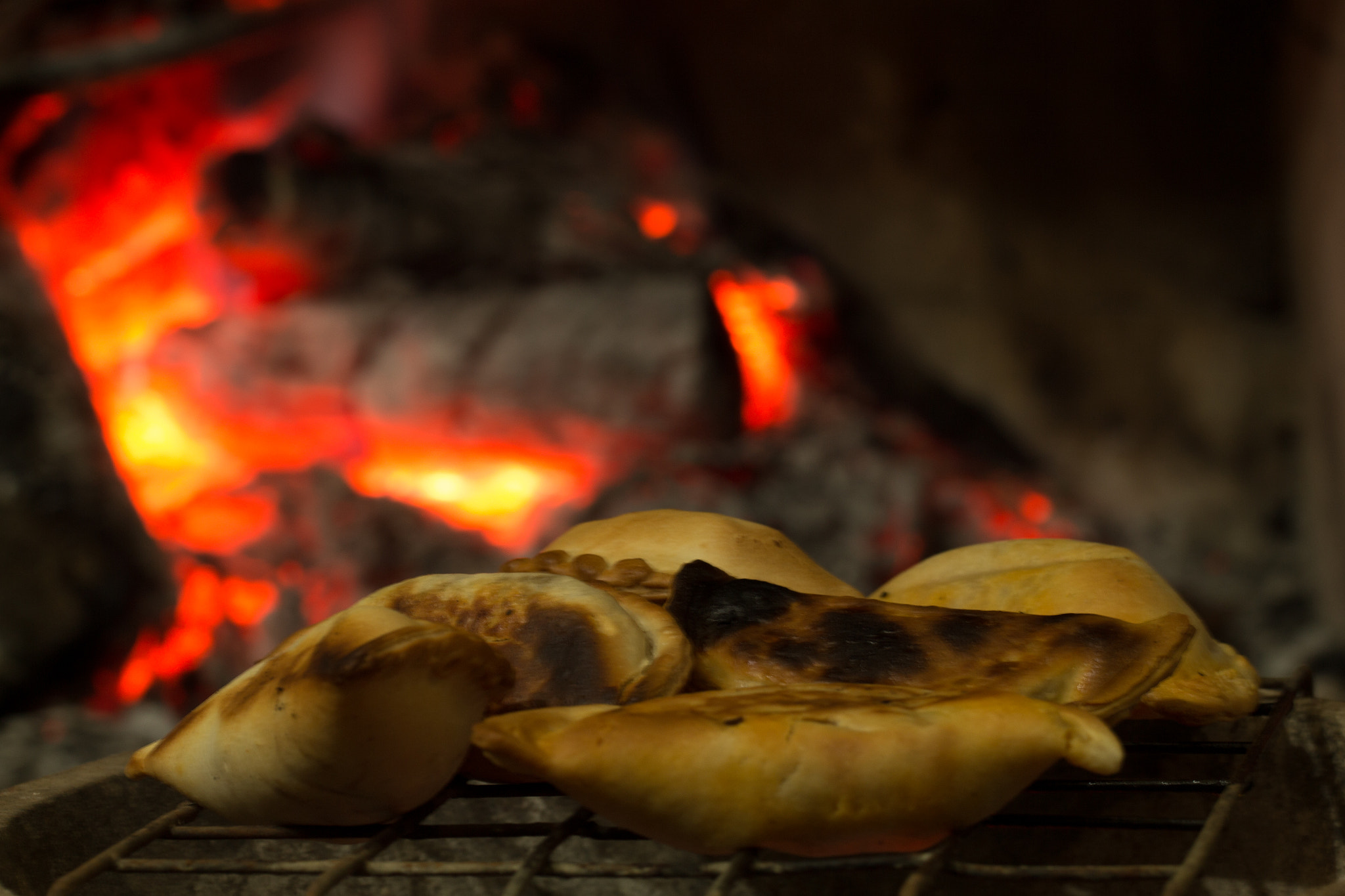 Canon EF 100mm F2.8L Macro IS USM sample photo. Cooking with embers at grill photography