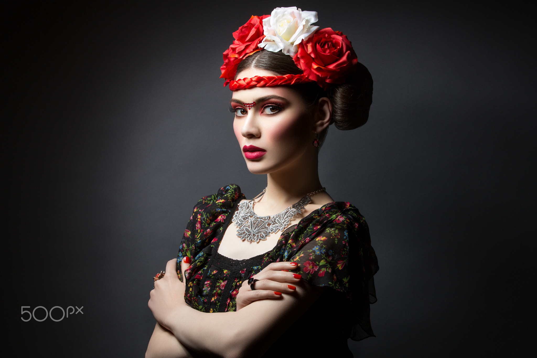 Beautiful girl with red lips and flowers