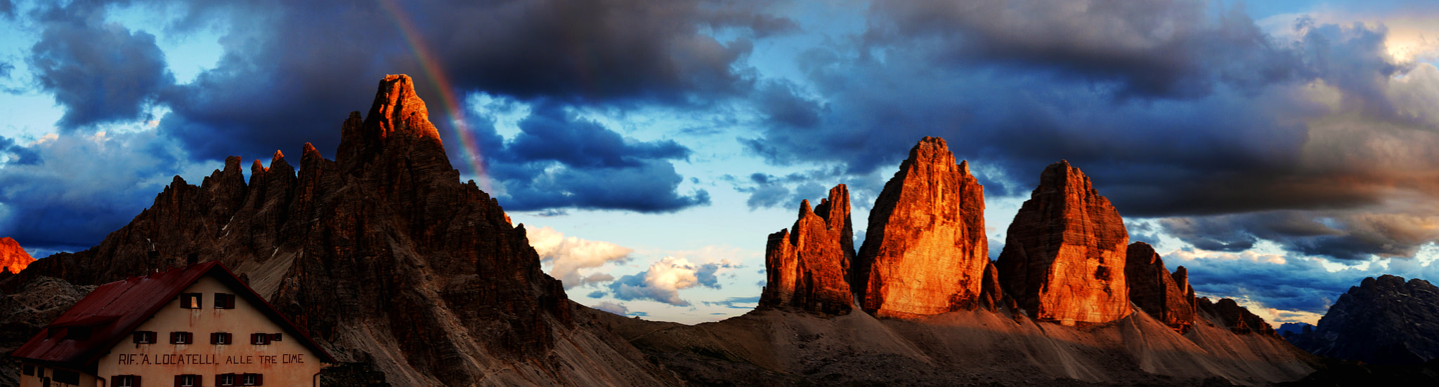 Panasonic Lumix DMC-GX7 + Sigma 19mm F2.8 EX DN sample photo. Rainbow at sunset tre cime photography