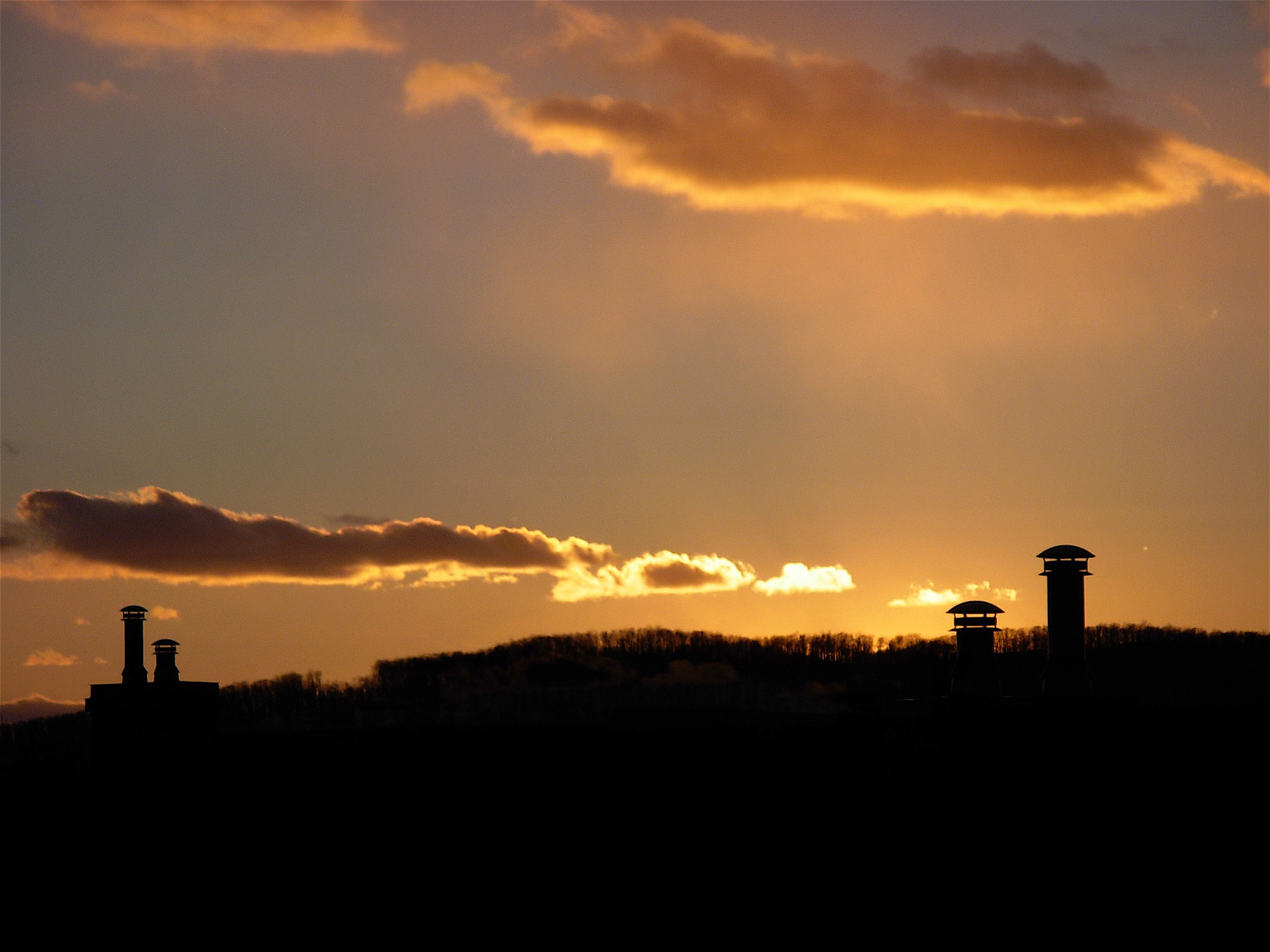 Nikon COOLPIX L5 sample photo. Smoke stacks at sunset photography