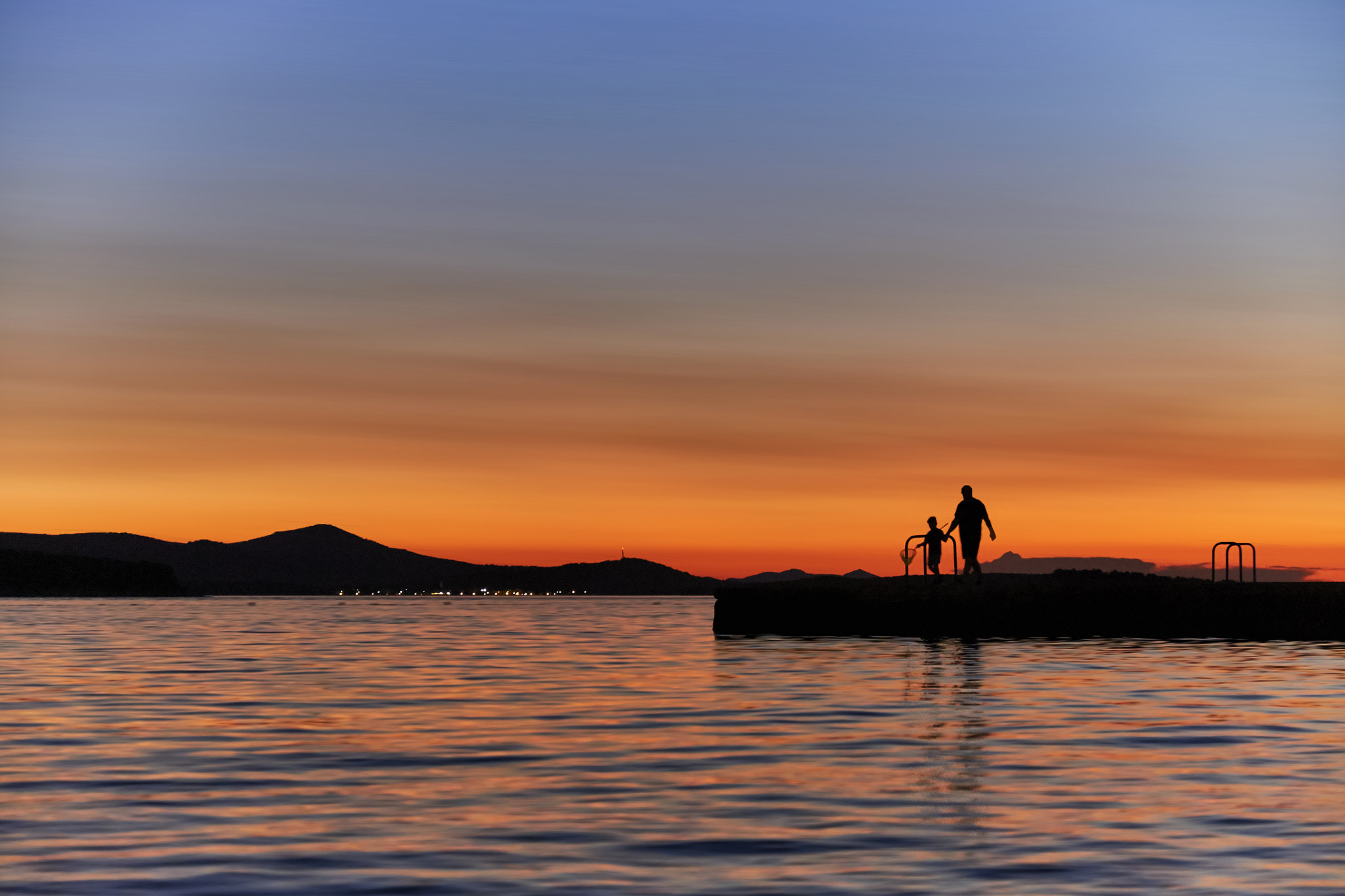Fujifilm X-M1 + Fujifilm XF 18-55mm F2.8-4 R LM OIS sample photo. Father and son go fishing photography