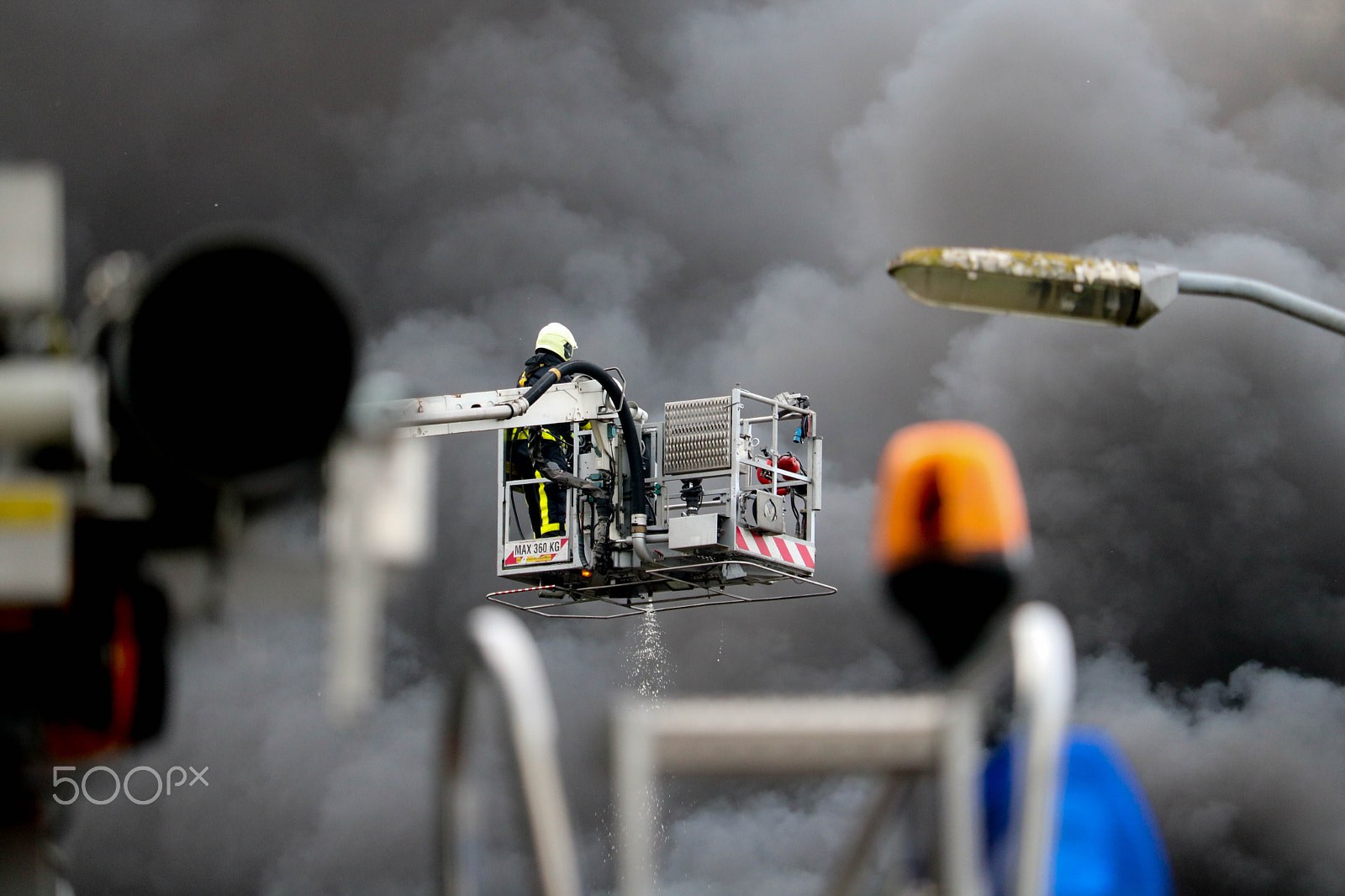 Canon EF-S 55-250mm F4-5.6 IS STM sample photo. Fire fighter on platform photography